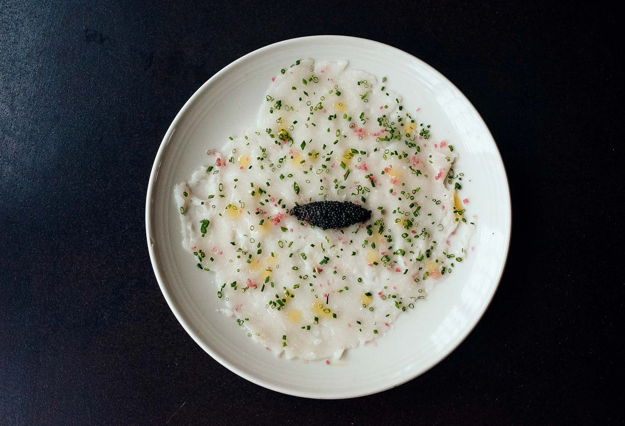 Maine scallop carpaccio is not only beautiful but also the perfect contrast of sweet, buttery, tangy, and salty.