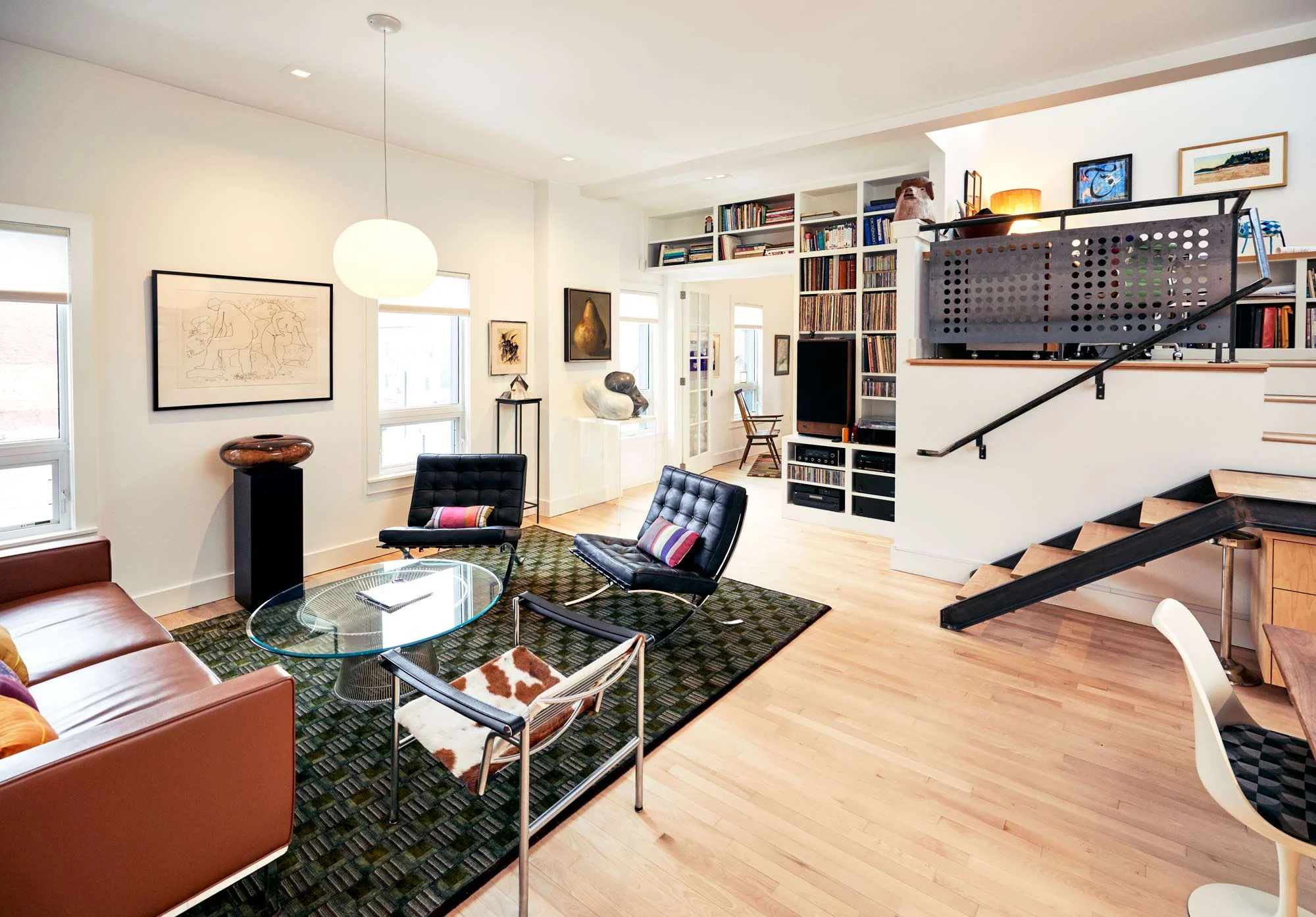 All of the living spaces are completely open and—like various aspects of the Reiter’s lives—flow into one another. A living room furnished with signature pieces is just off both Lauren’s and Neil’s offices, also the kitchen, and a dining room table at which they both hold meetings. The space is a domestic and professional nerve center.