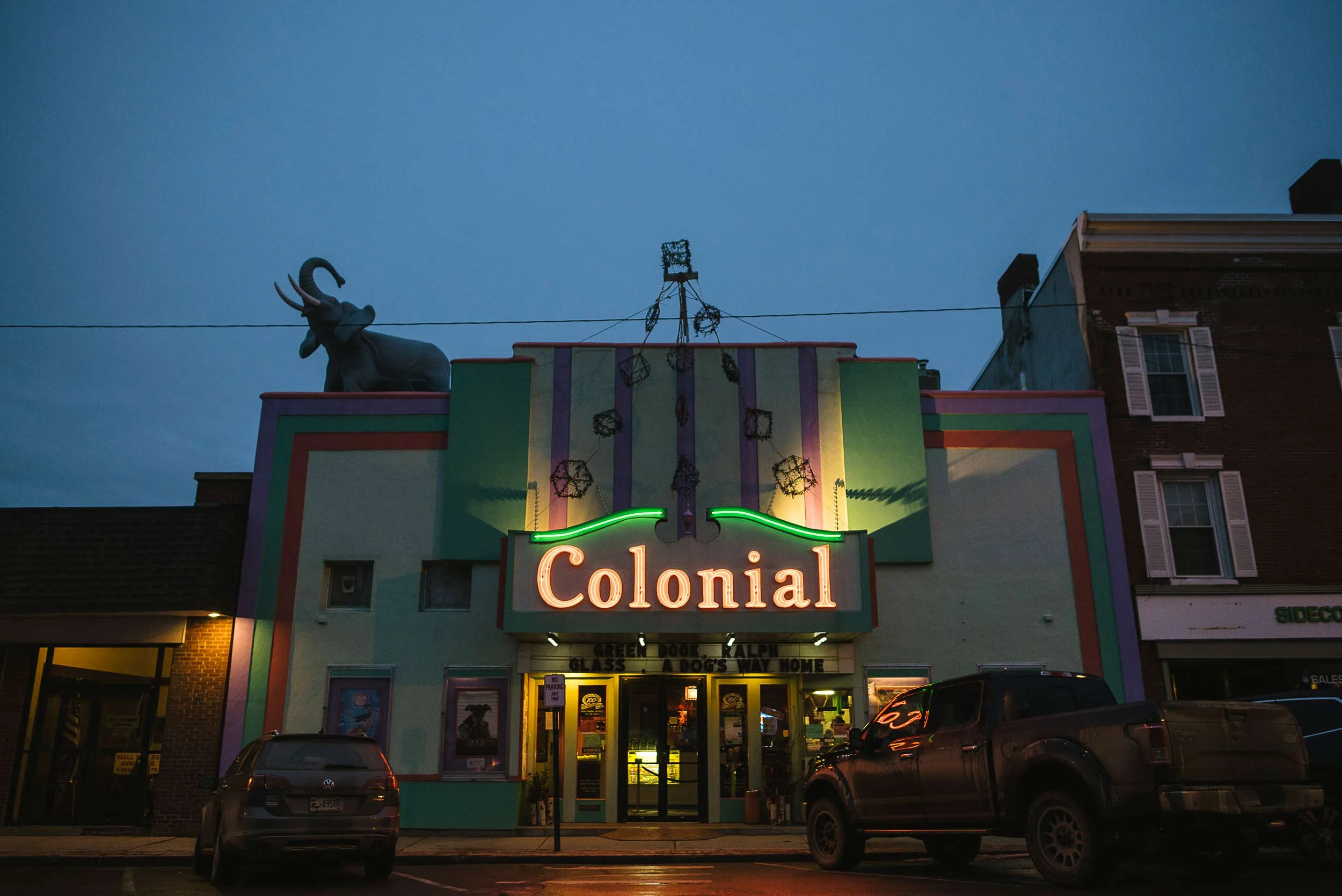 The show starts on the sidewalk with the Colonial Theatre’s neon marquee and Hawthorne the elephant trumpeting above High Street.