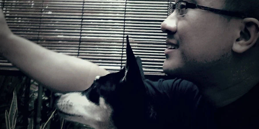 Daniel Lim, chilling out with his dog in less stressful times.