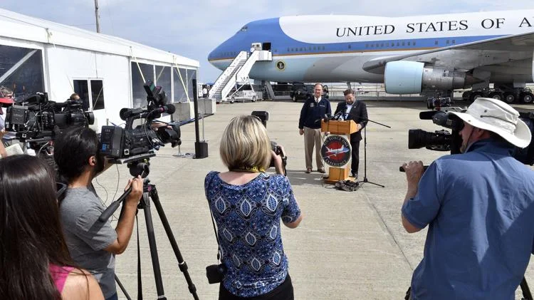 Ari Scharf, right, board chairman of the Children’s Democracy Project, and former Air Force One flight attendant Howie Franklin address members of the media during a preview tour of the Air Force One replica at Quonset State Airport Sept. 14. Photo: Michael Derr