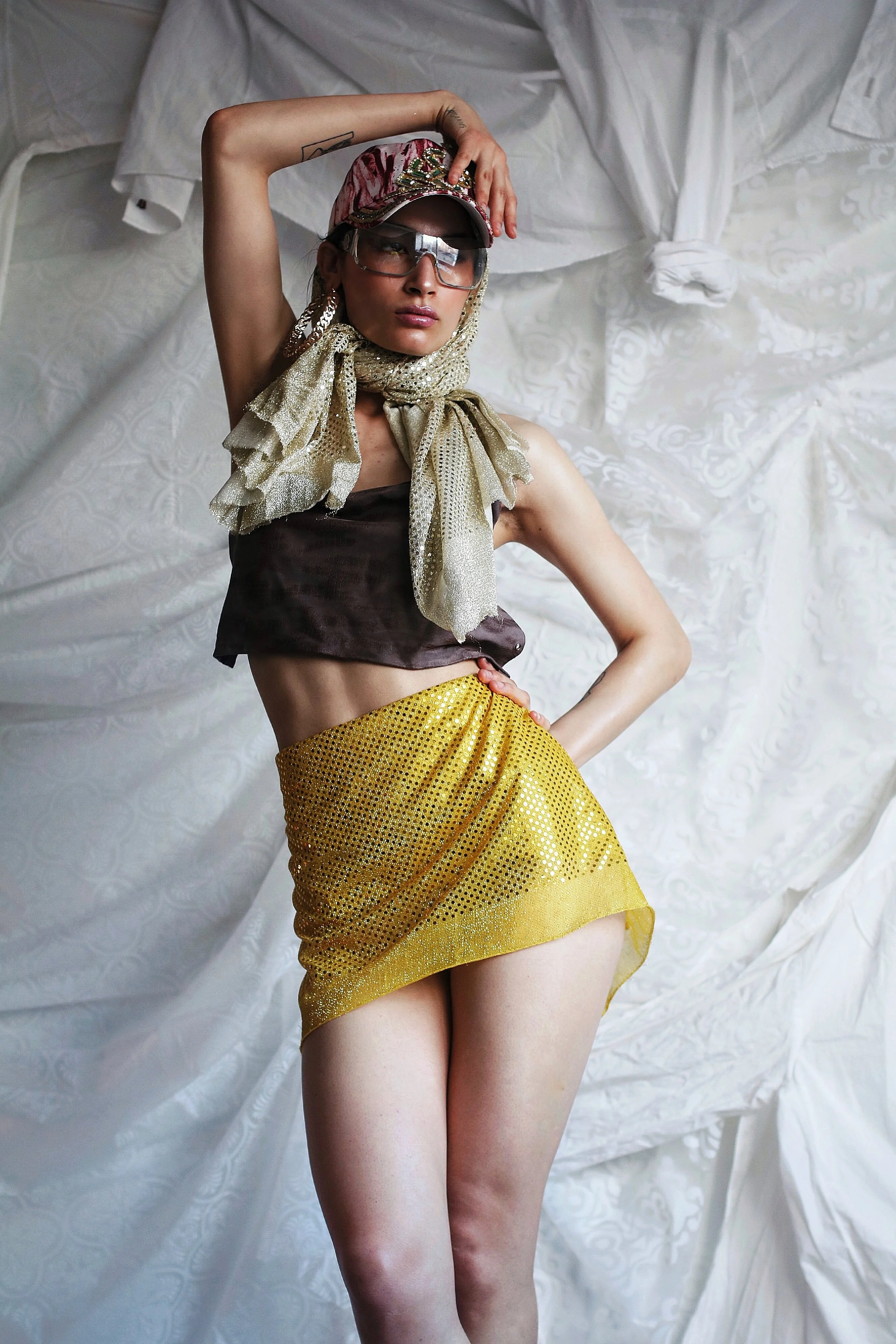 Glasses: Baby Phat. Scarf: Balenciaga. Skirt: Discount Universe. Top: Helmut Lang.