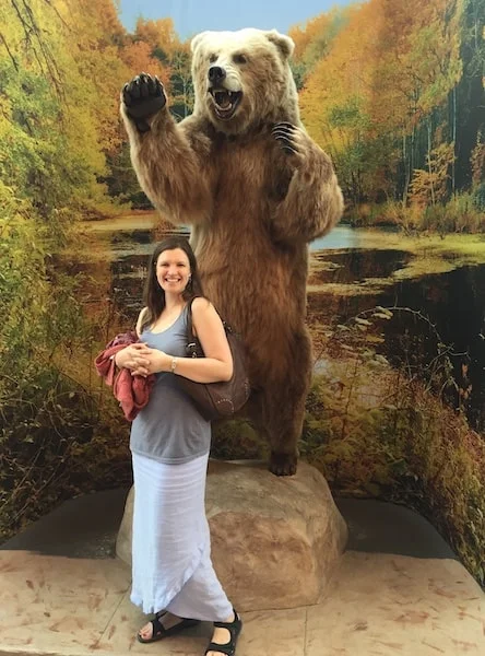 Gabrielle Usatynski in front of bear display.