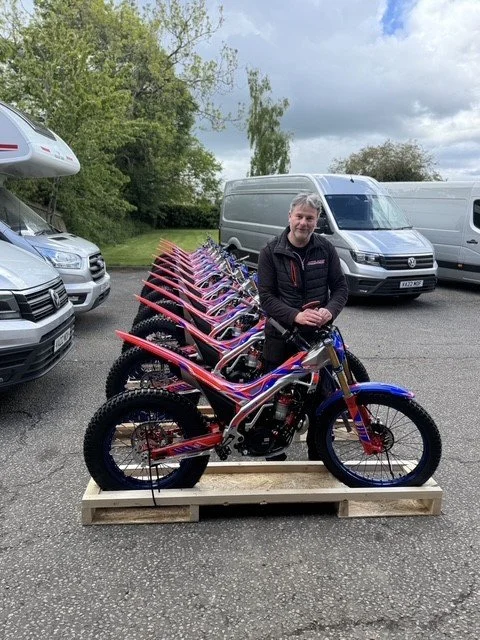 Neil - Acklams mechanic standing with a delivery of brand new Beta factory sincros