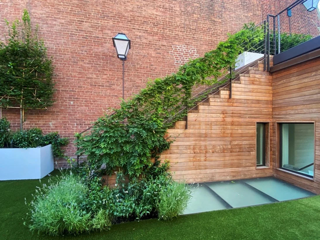 06_UPPER EAST SIDE ROOFTOP_wisteria railing lavender.jpg