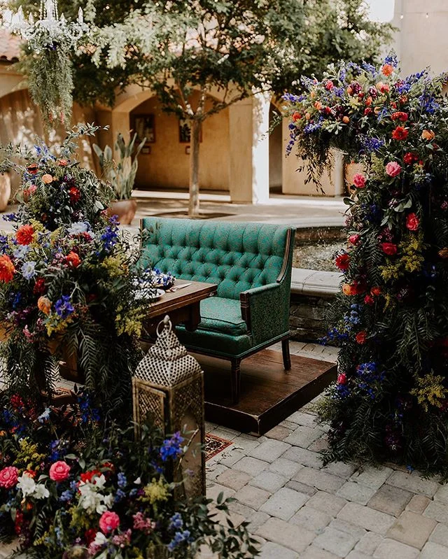 It takes a lot of couch to stand out from all those flowers 😉
-
Coordination: #confettiskies
Florals: @beautifulsavageflowers
Photography: @charissaimiko
DJ &amp; Photo Booth: @voxdjs
Venue: @serraplaza
Catering: @24carrotscatering 
Cake: @simplysweetcakery 
Hair &amp; Makeup: @designvisage
Transportation: @lakeforestlimos 
Vintage Rentals: @sundrop_vintage
Wedding Dress: @daughtersofsimone 
Suits: @friartux
-
#BSF #beautifulsavage #beautifulsavageflowers #bsflower  #savageflowers #floristlifeunfiltered #floristlove #serraplaza #sanjuancapistrano