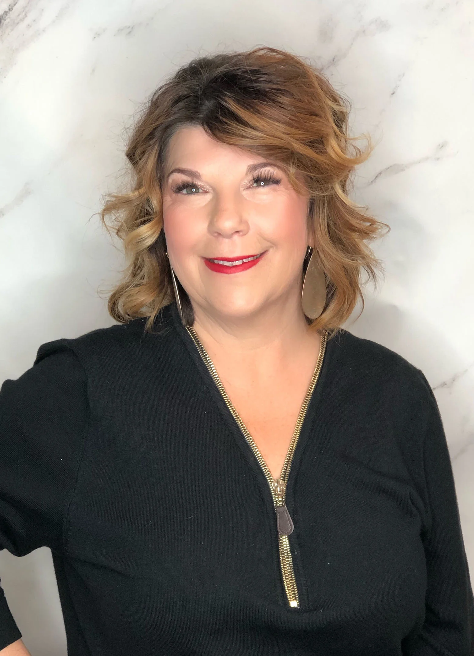 Jenny is the salon manager at Fringe. Customer service is her middle name. She will greet you with a friendly smile and help you with any hair care needs. Come in for a tour and she will have a fresh cup of coffee brewing.
