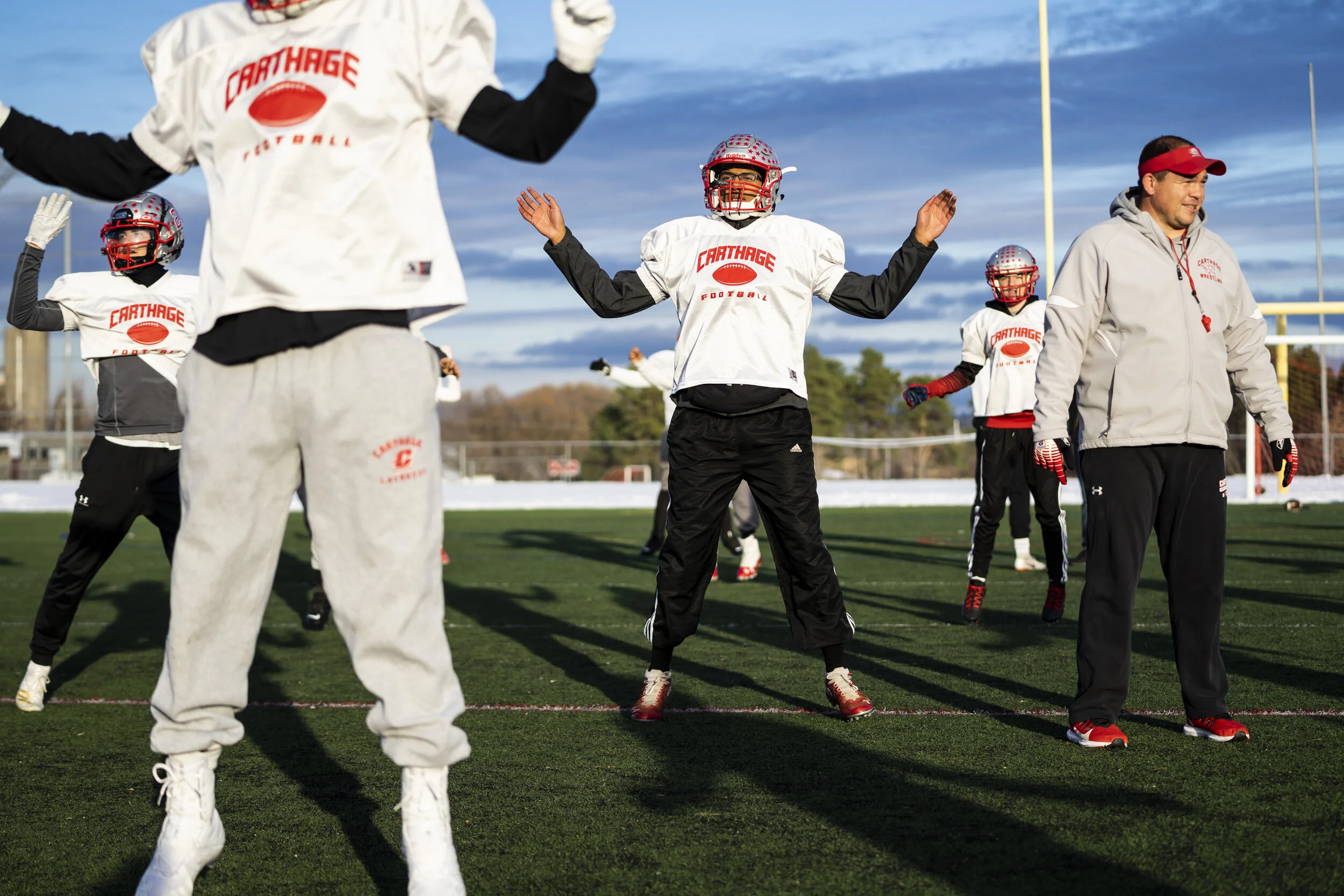  Members of the Carthage Comets warm up during practice on a sunny afternoon in November. 