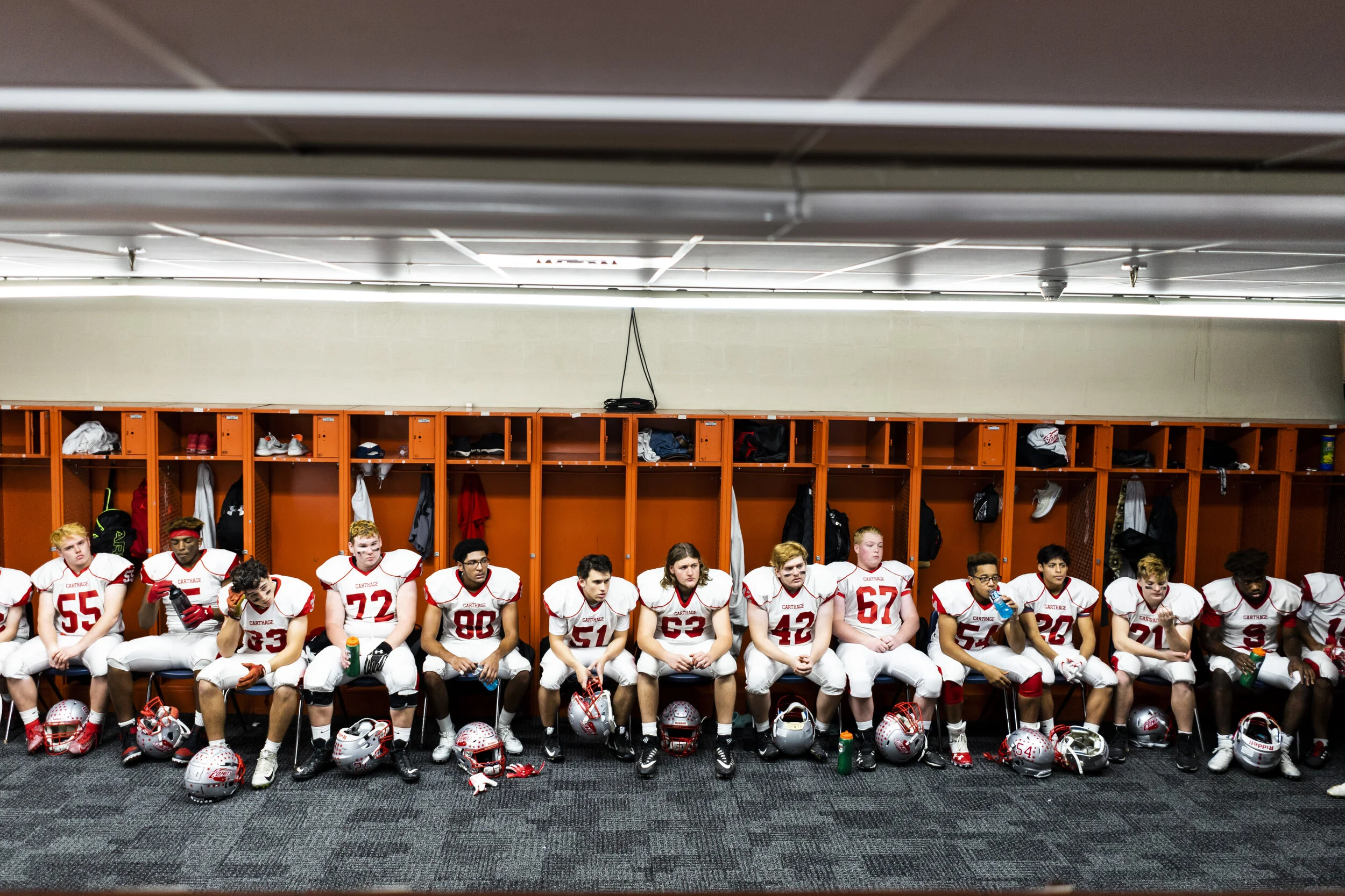  The pensive Carthage comets sit quietly in the locker room during halftime of the Section A Class Championship game against Cornwall on November 29, 2019. 