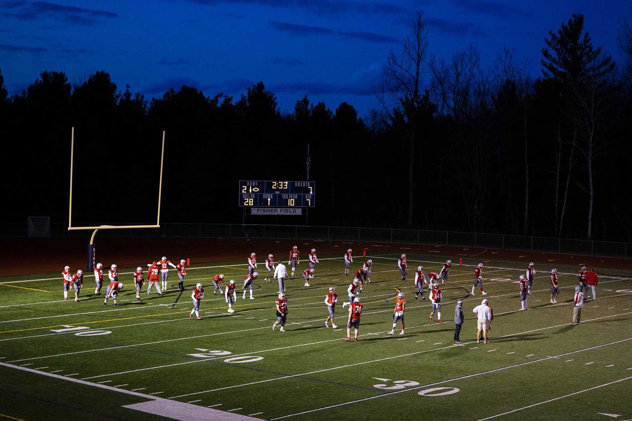  The Comets warm up beneath indigo skies before a matchup against General Brown on a cold Friday night under the lights. 
