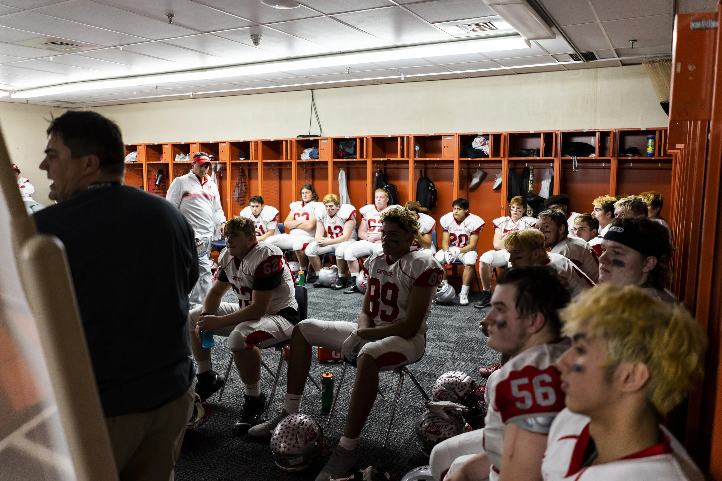  Head coach Jason Coffman gives last words of advice to a tense locker room during halftime of the state championship game. 