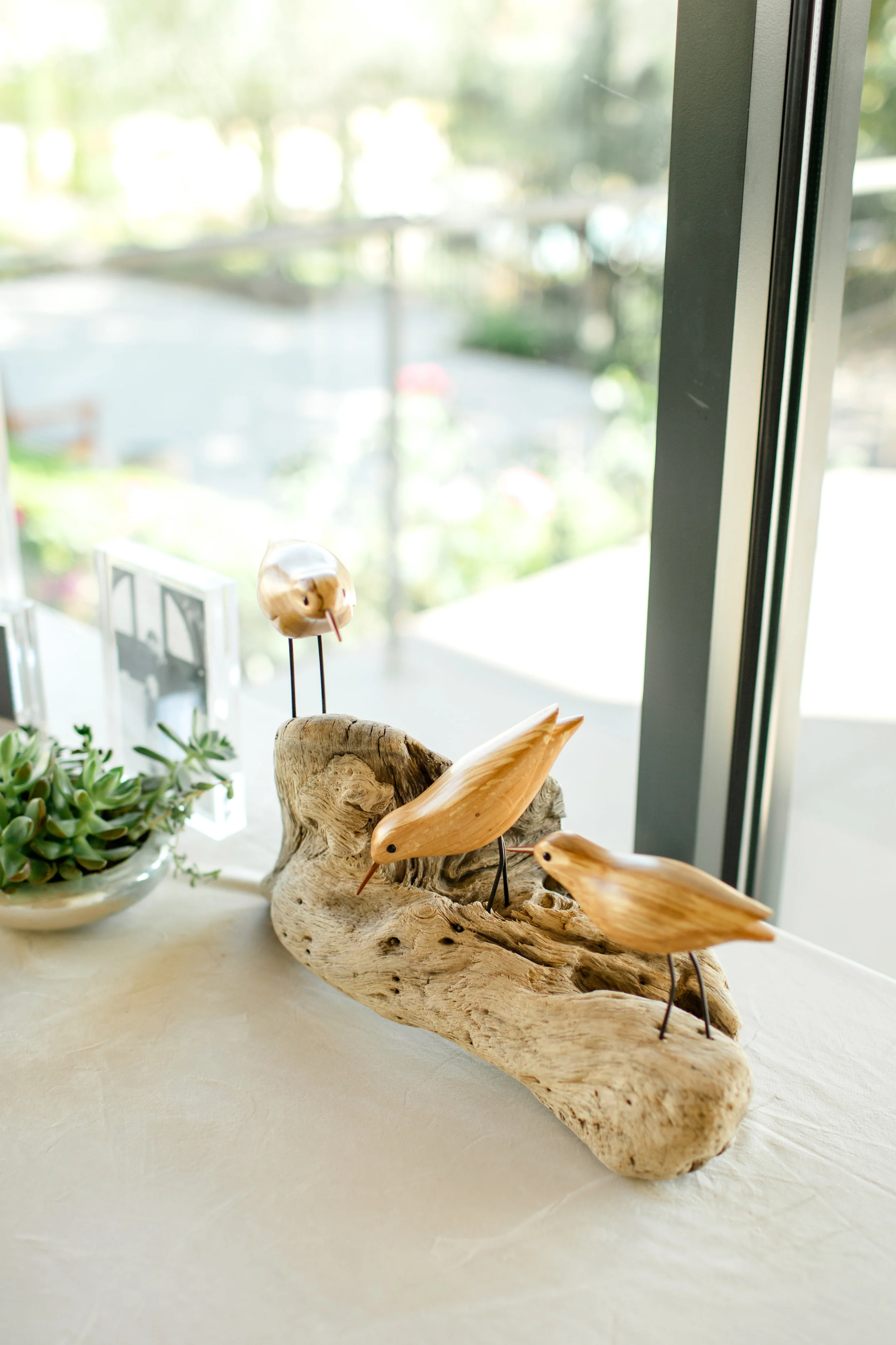  Featured on the welcome table was a flock of Sandpipers carved by Robert’s father, Gordon, as a wedding gift to the couple. 