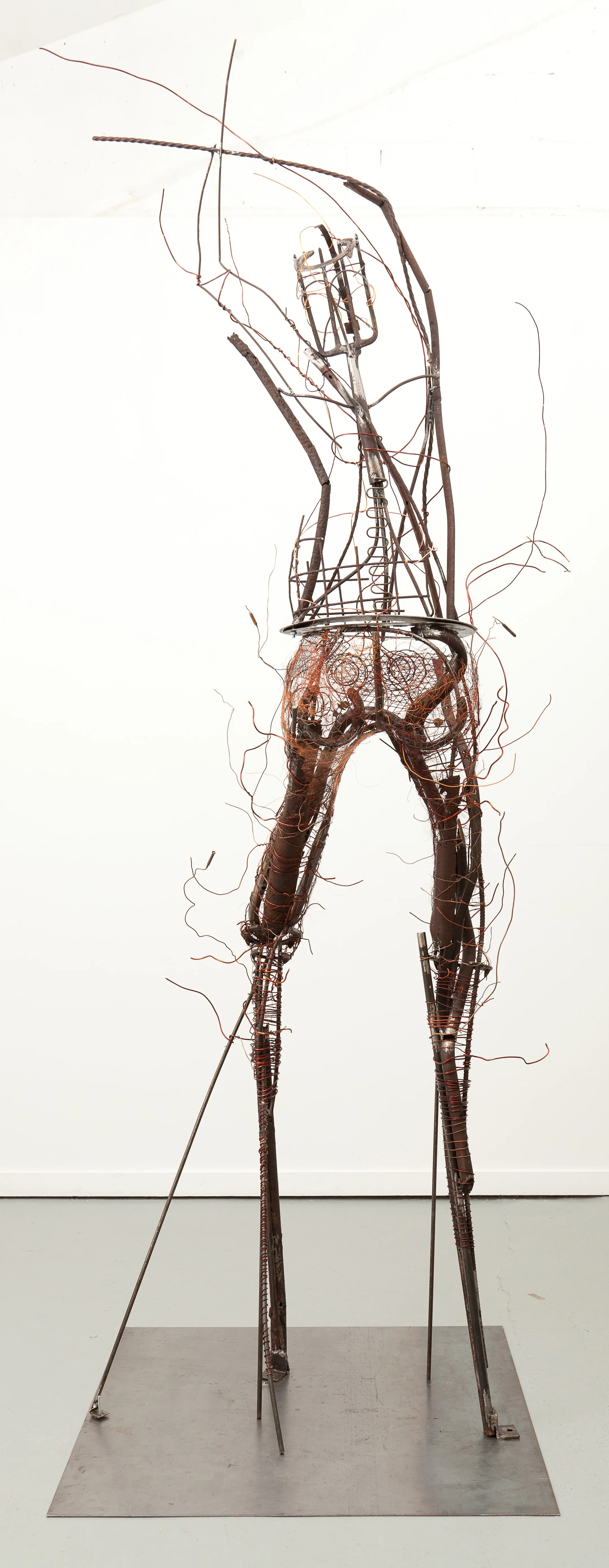 Man models himself on Earth, Earth on Heaven 3.6m high recycled metal.jpg