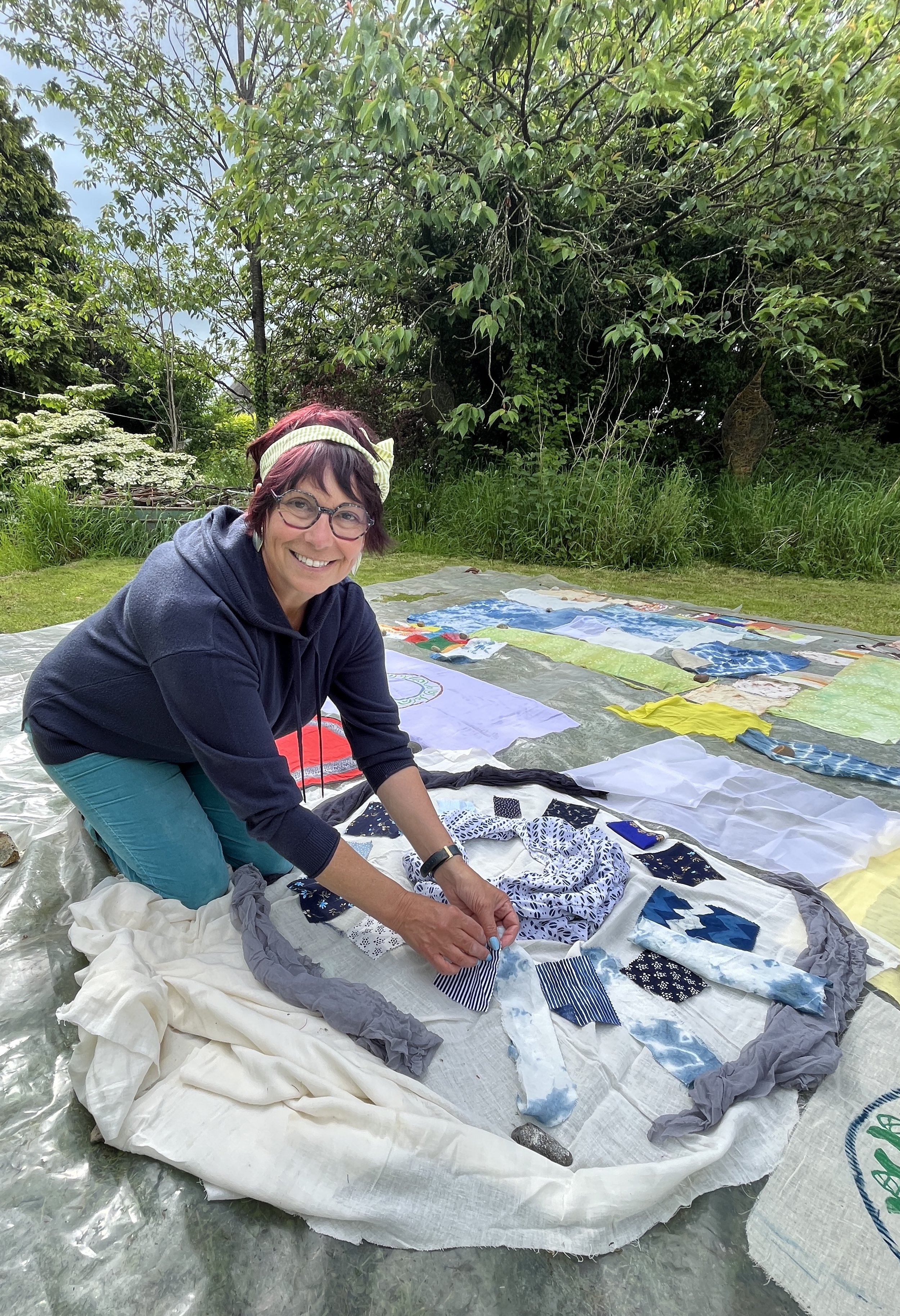 Gill spreading out her swatches, The Gleaning.jpeg