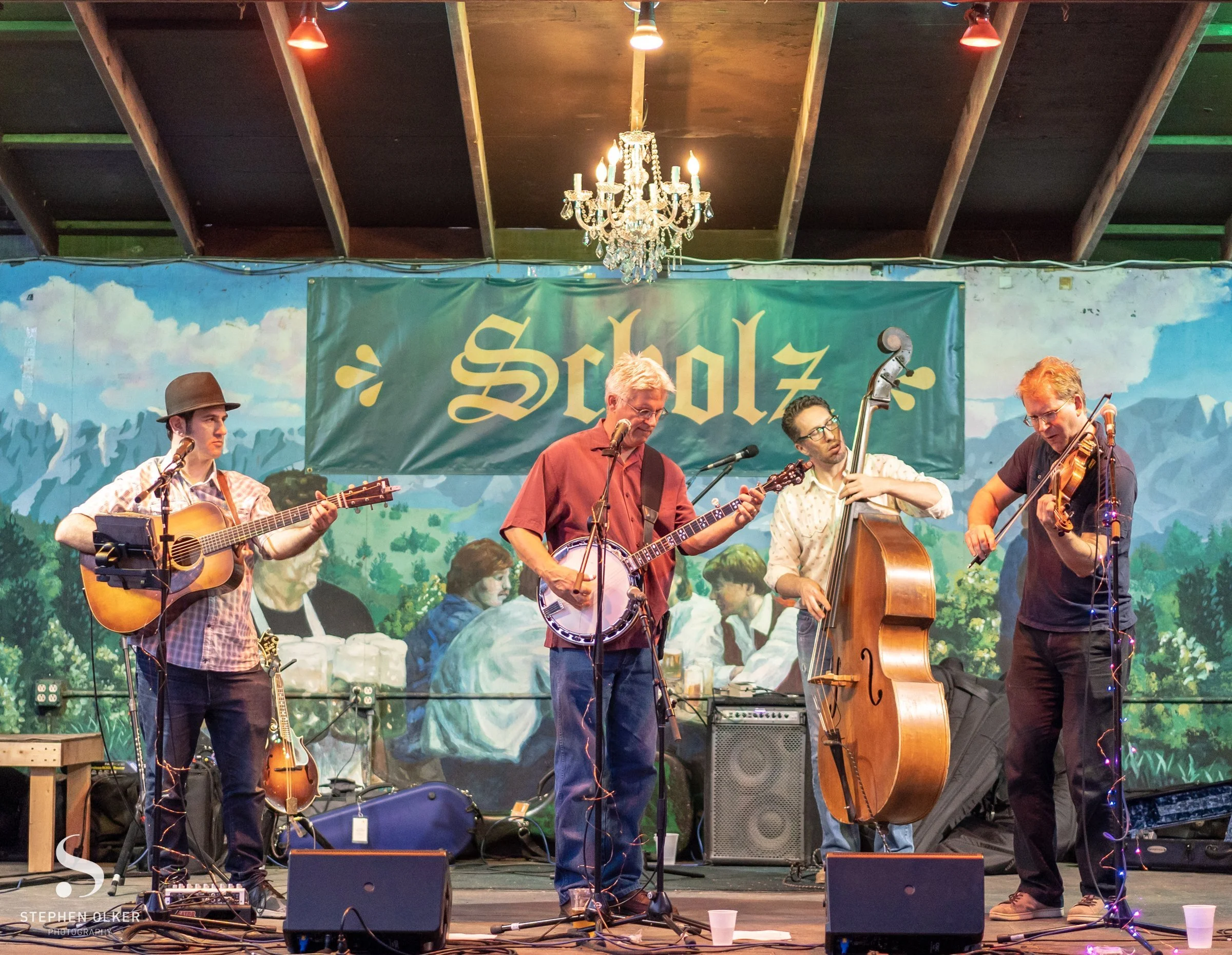 Hot Pickin 57s playing under a chandelier and painted mural at Scholz Garten in Austin