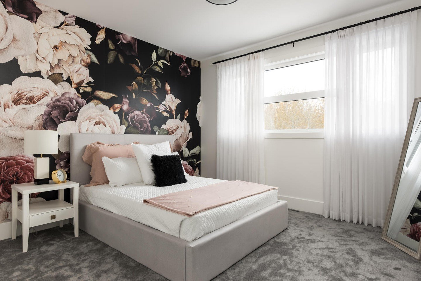 Proof that basement bedrooms don&rsquo;t have to feel like basements&mdash;natural light and oversized windows completely transform the space.