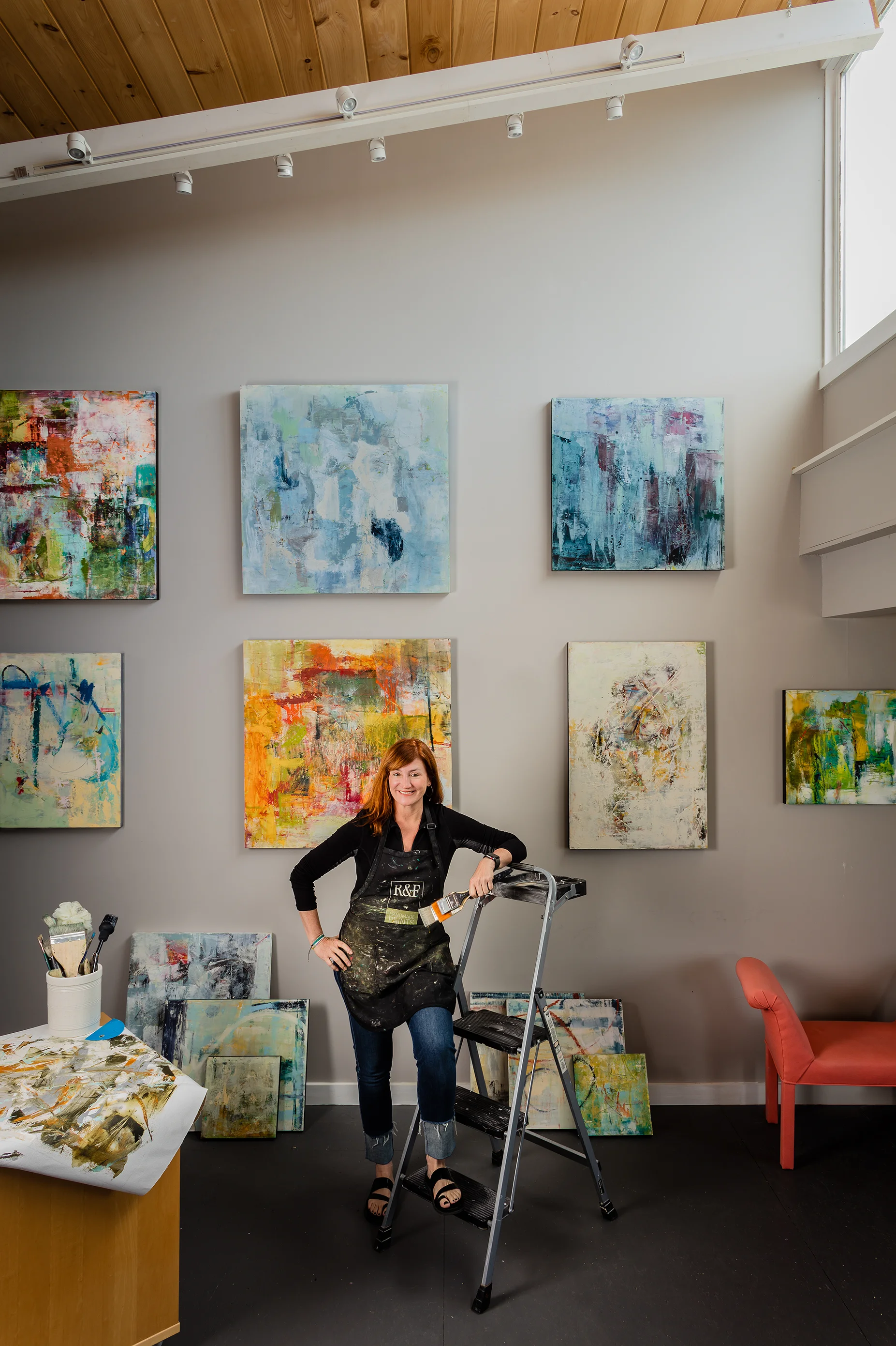 Artist Sallie Strand in her Rocky Neck gallery. Photographed by Michael J. Lee