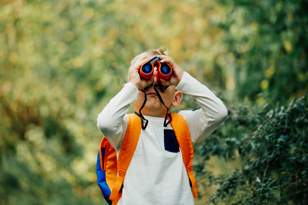 The-little-boy-young-researcher-exploring-with-binoculars-1041187486_1258x838.jpg