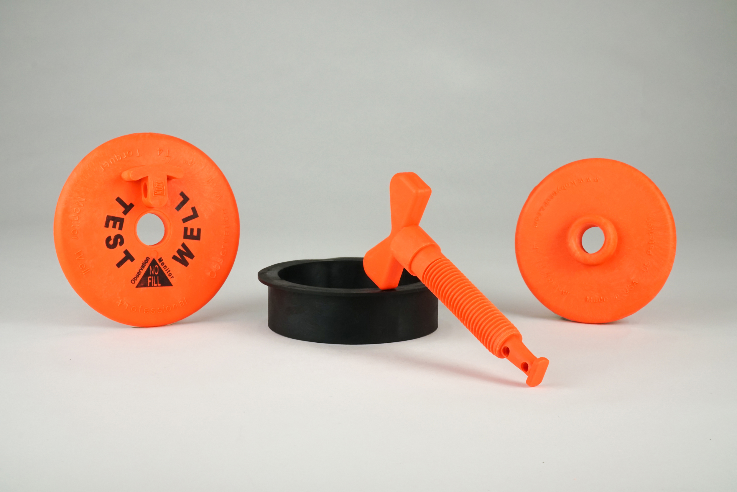 4” TORQUER PLUG PARTS FEATURING TOP CAP WITH BOLD LETTERED WELL INFORMATION, DUAL PURPOSE DEEP SEATED EXPANSION GASKET AND FADE RESISTANT BRIGHT ORANGE COLOR