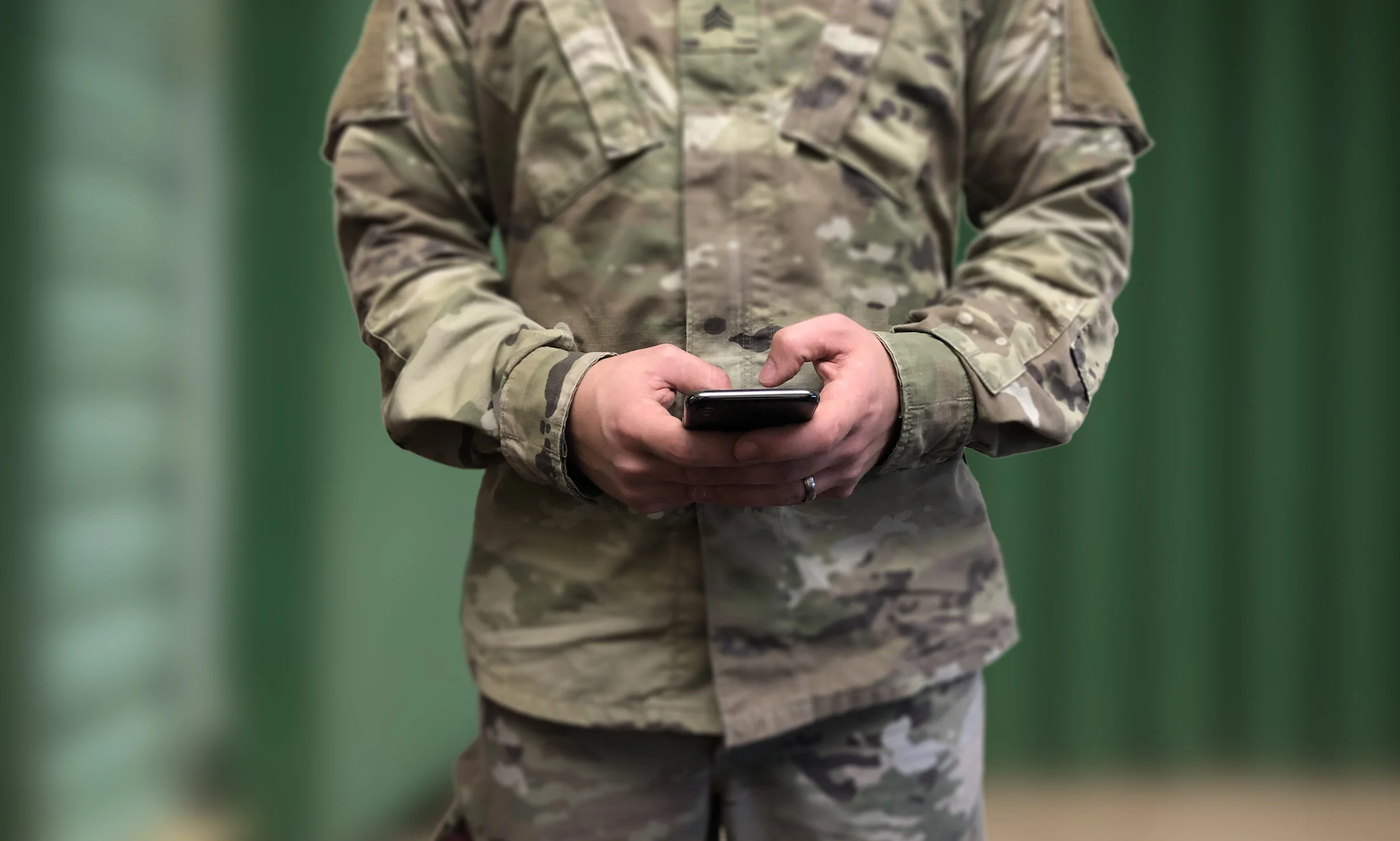 Solider with phone background (1).jpg