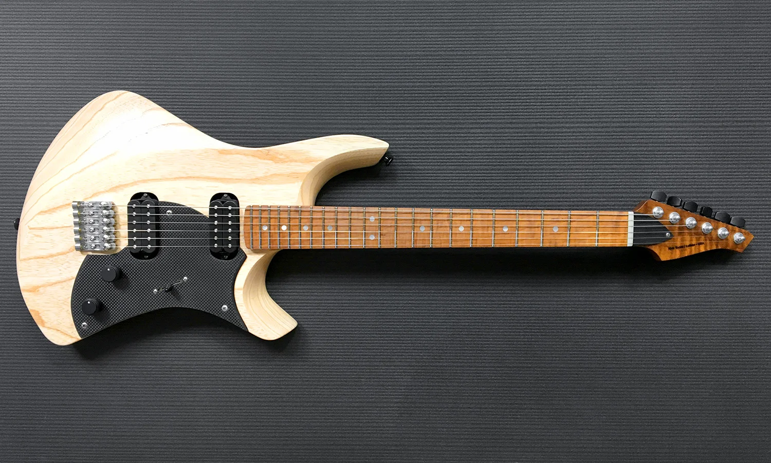 PHOTO: Intonation Cantilever™ precision machined stainless steel solo bridges, Carbon fiber pickguard, OEM DiMarzio pickups.