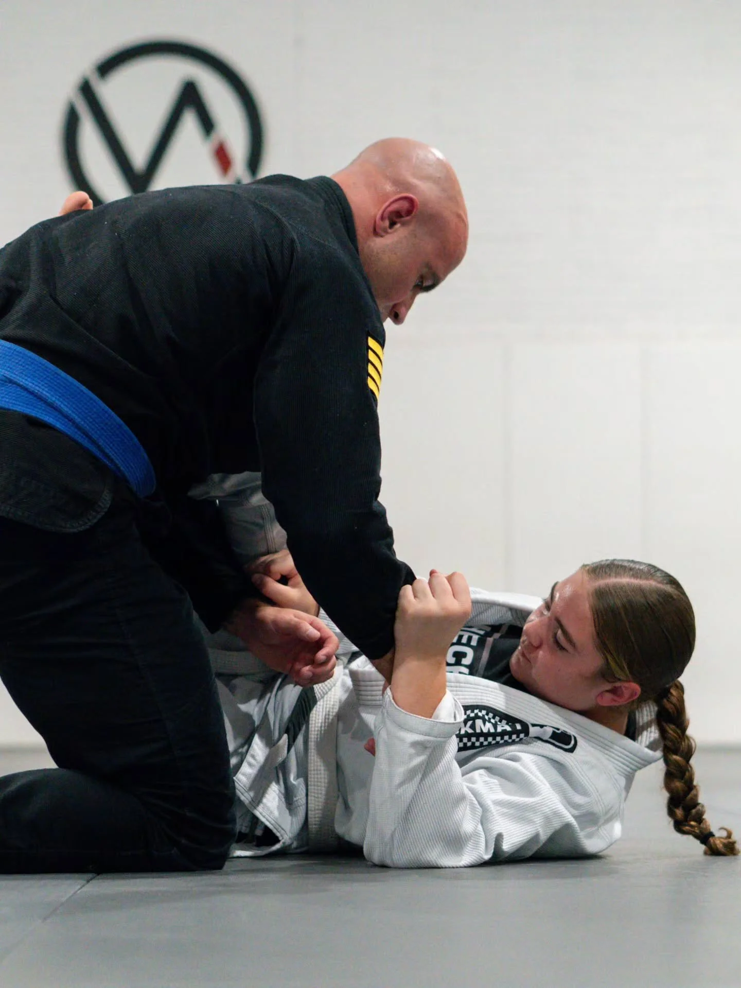 Some of the best memories aren't made watching from the sidelines.

They're made on the mats together.

Jiu-Jitsu is one of the few activities where parents and their kids can walk the same journey.

Different belts. Different ages. Same mats.

That'