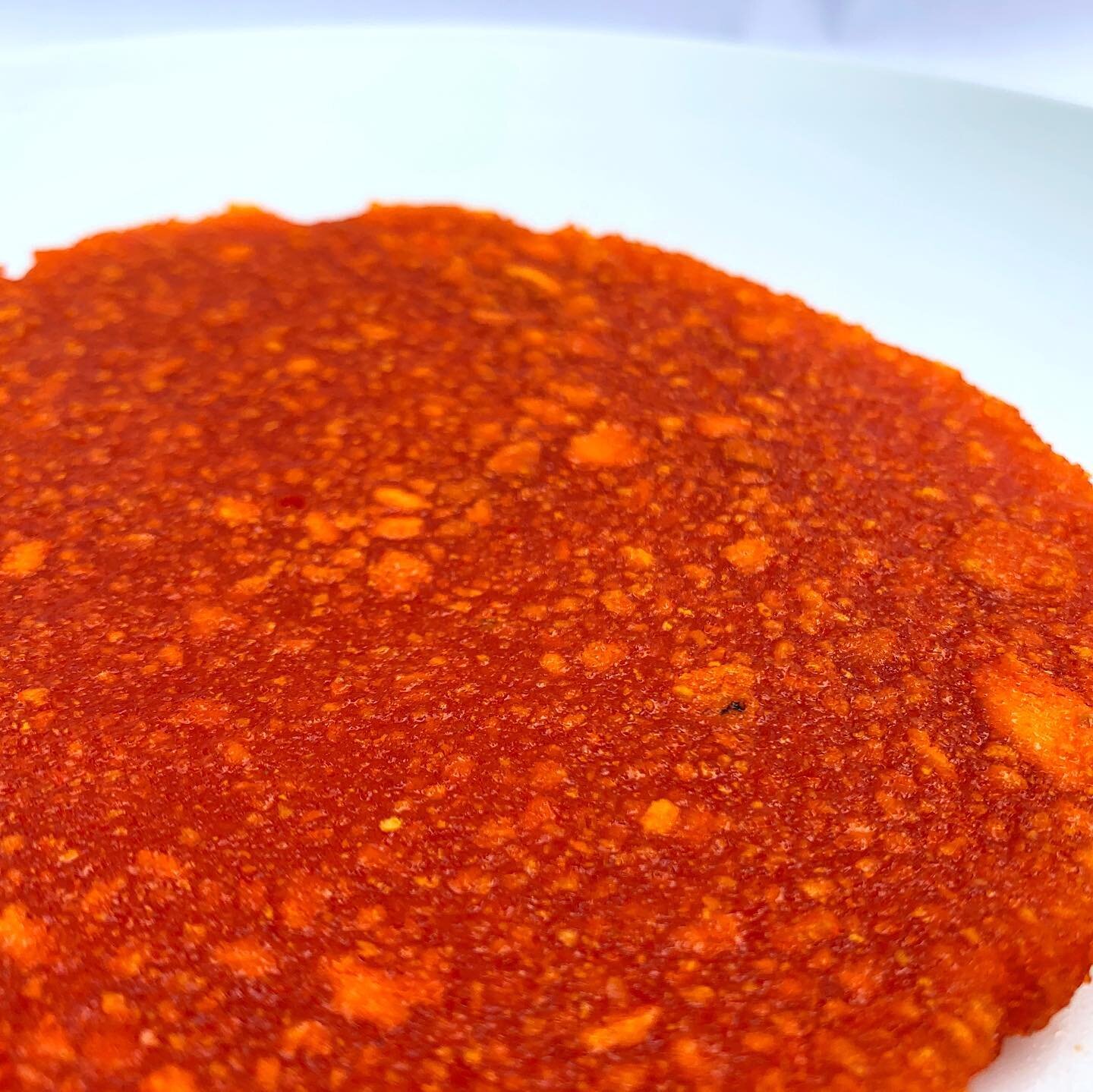 Orange peel biocomposite - Dried and powdered orange peels set together to make a rubber-like material. Depending on the consistency and thickness of the binding agent, it can become bioplastic.