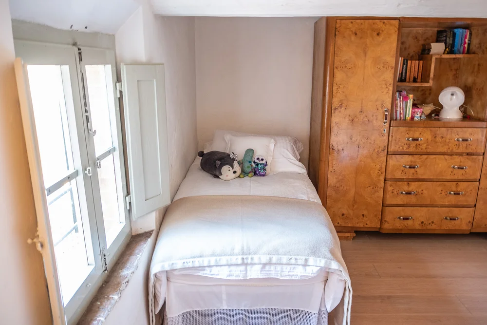  Audrey’s bed with her toys, by the window.  