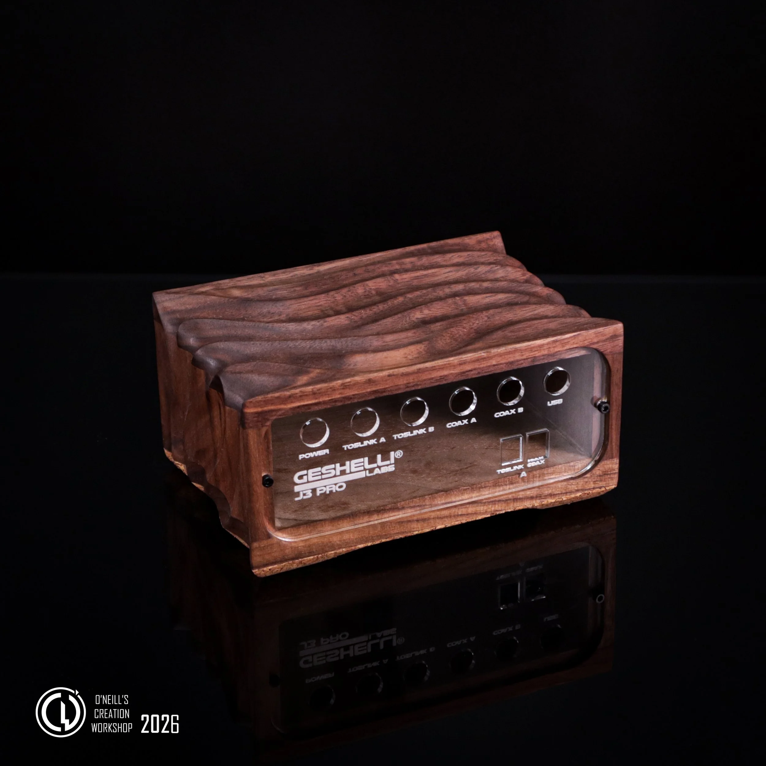 Black-Walnut-Geshelli-labs-J3-custom-carved-case-2026-1.jpg