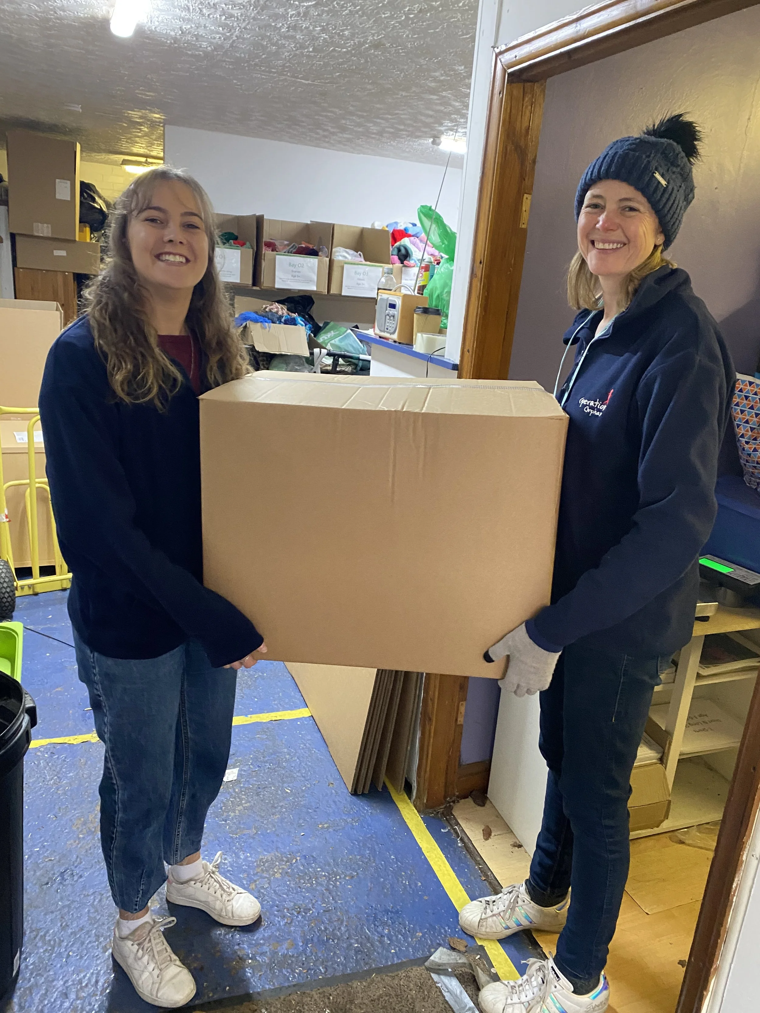 Kelly and Jo carrying a box .jpg