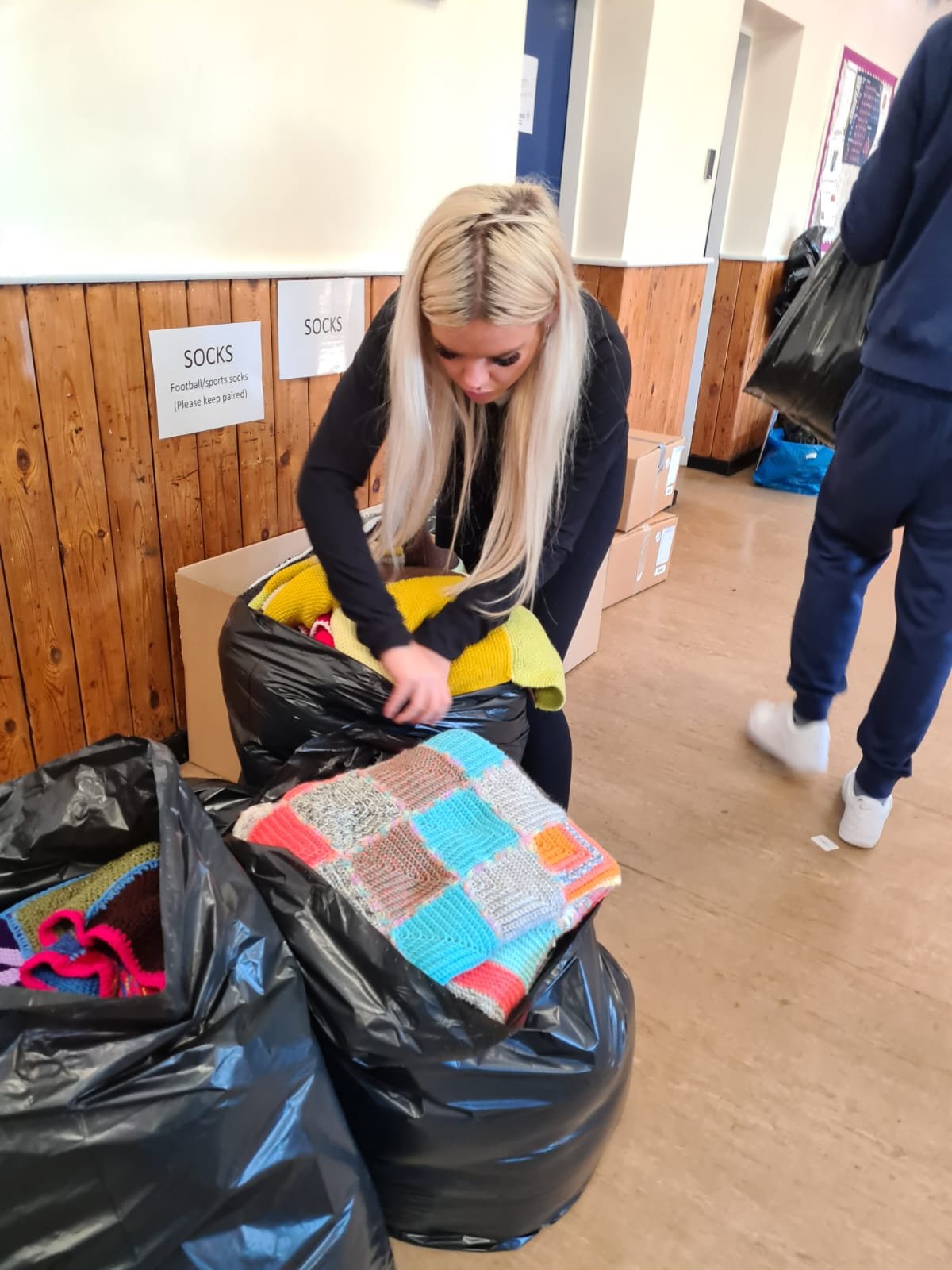 putting blankets into bags.jpeg