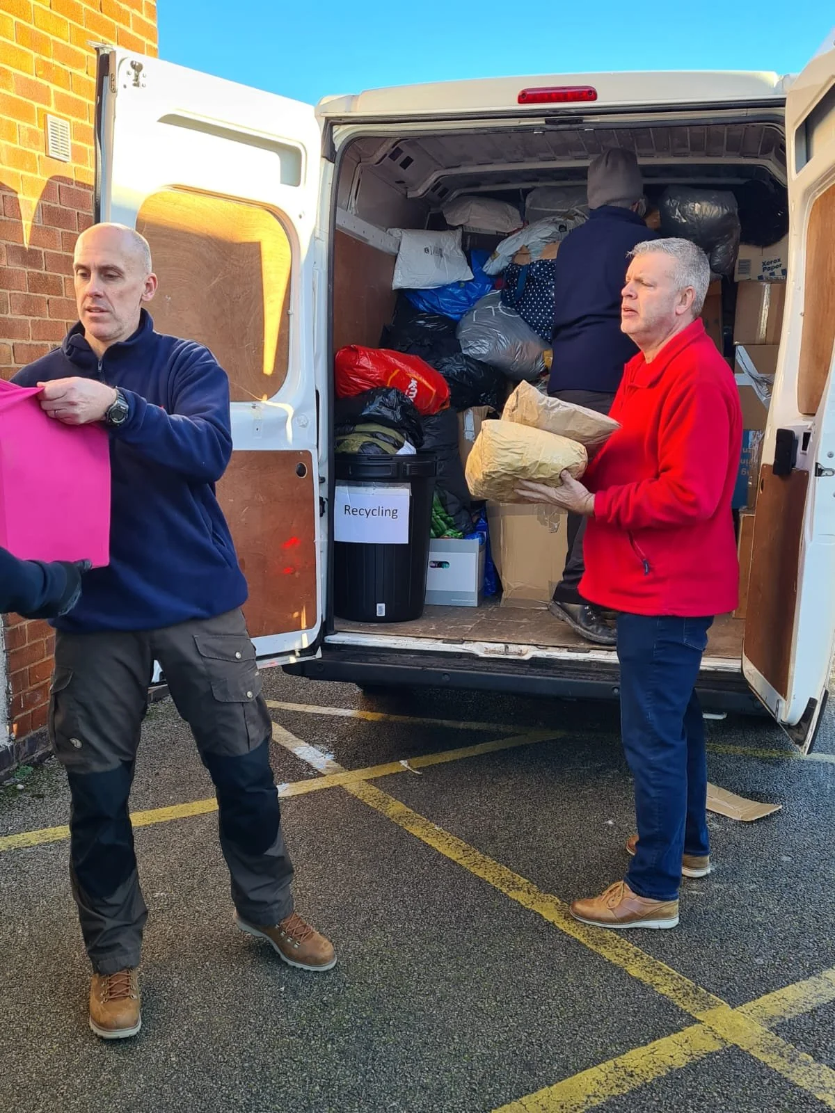 Dave handing off pink item.jpeg