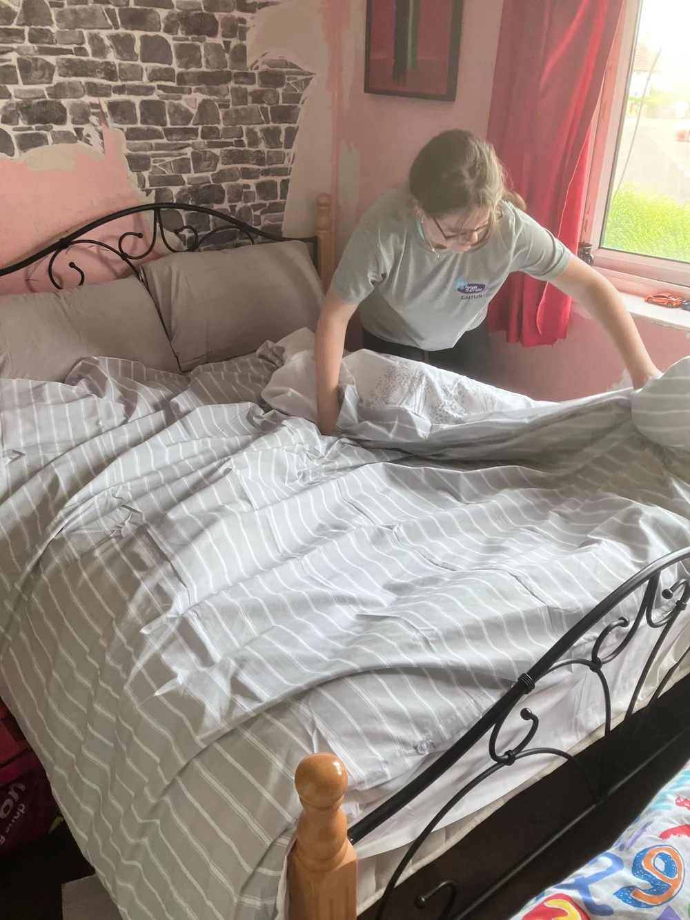 putting duvet on bed.jpeg