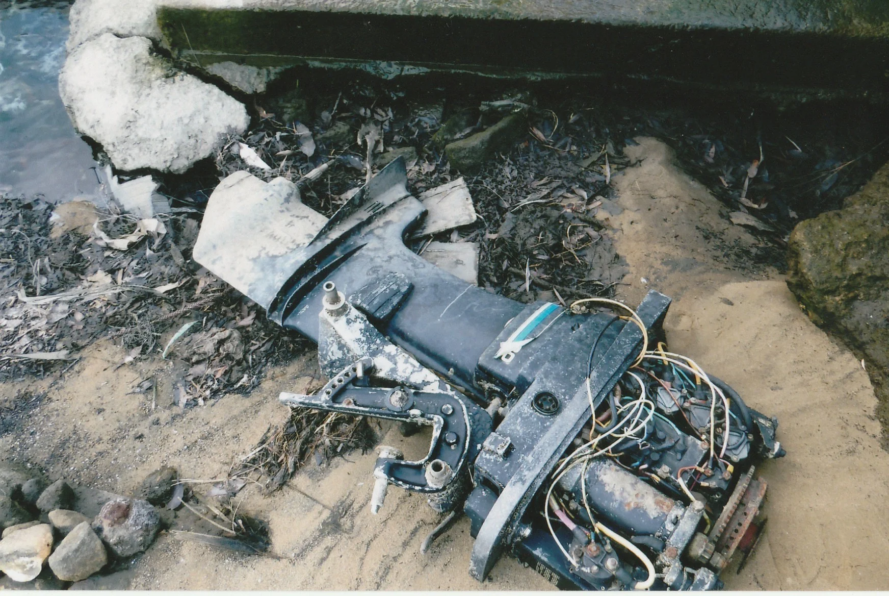 Outboard Motor in the bay by the edge of Park Road Reserve, Kogarah Bay (since 2018). First reported to Council in Mar 2018 and multiple times since. It still sits there today.
