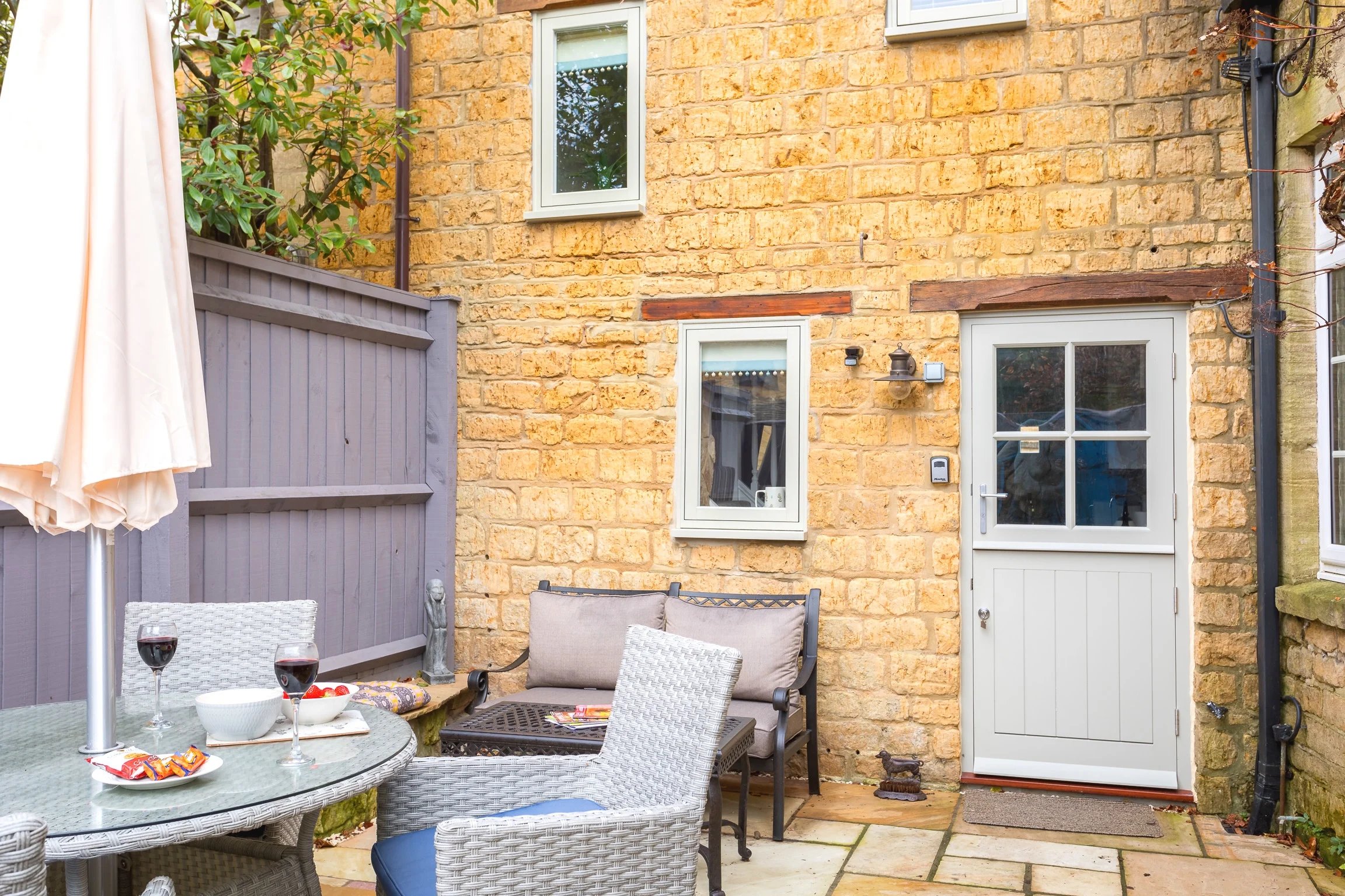 The exterior view of Little Gem Cottage, a building over 200 years old that was once a garage