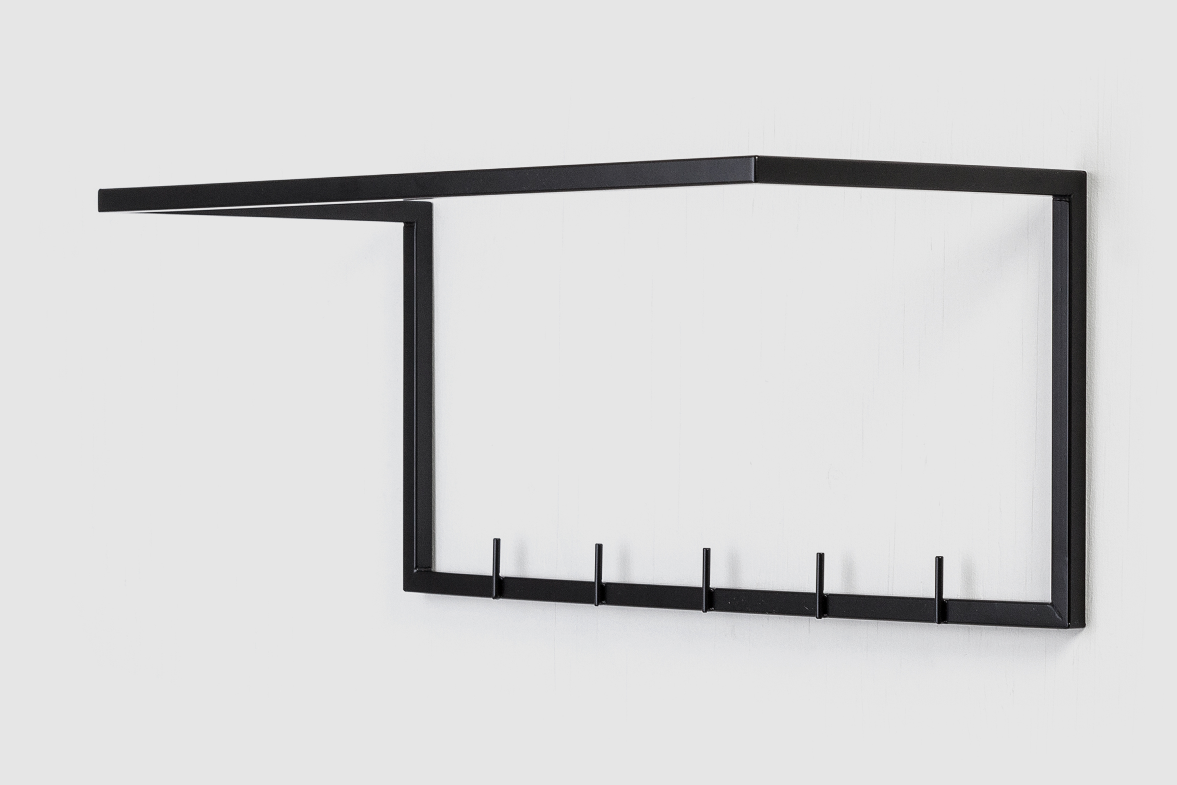 mllmtr_shop image 01_L1-600 BLACK_wall mounted clothes rack_right side high_GREY BACKGROUND.jpg