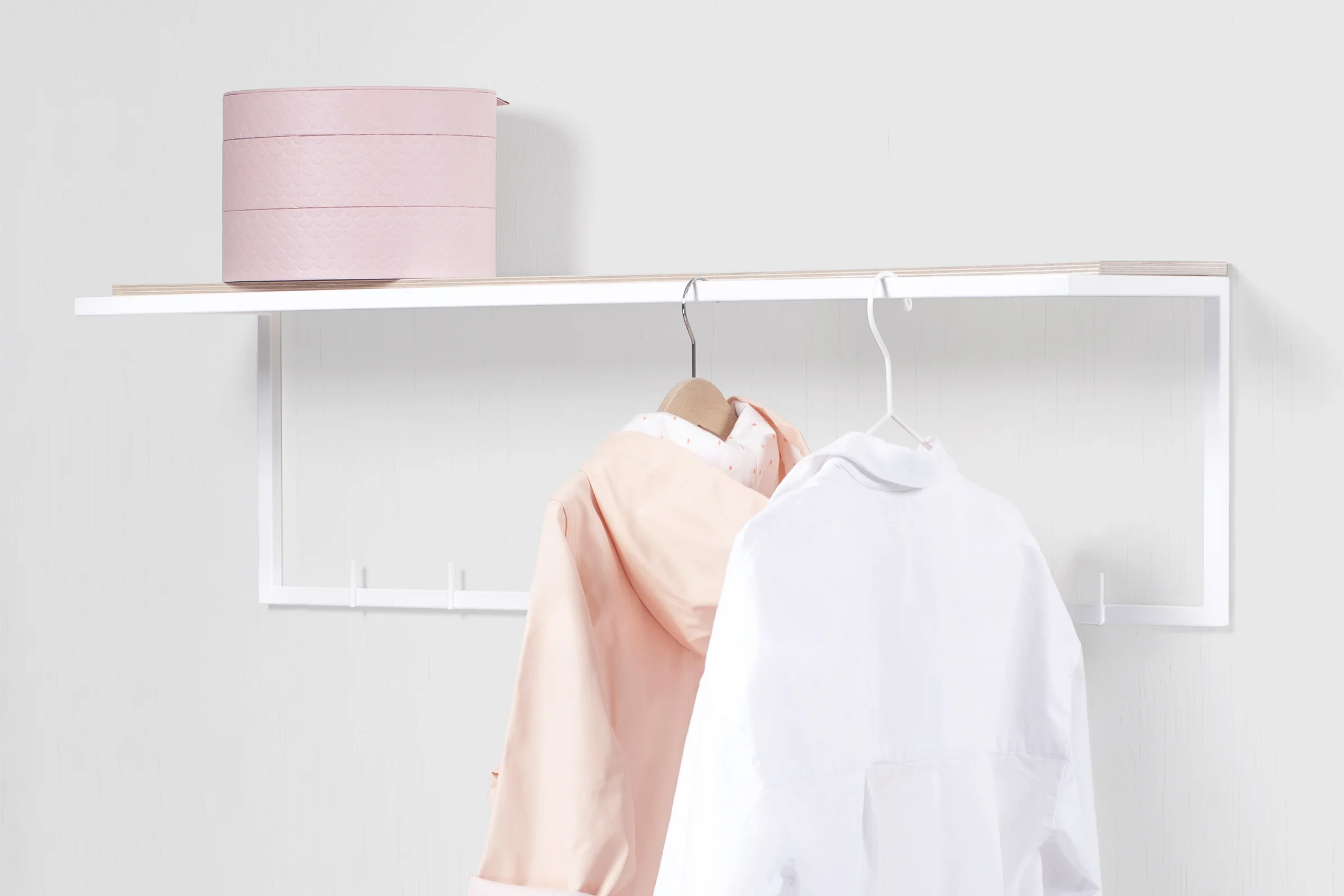 mllmtr_shop image 06_L1-900 WHITE_wall mounted clothes rack_right side view_white laminated plywood shelf_salmon kids raincoat_powder vanity box.jpg