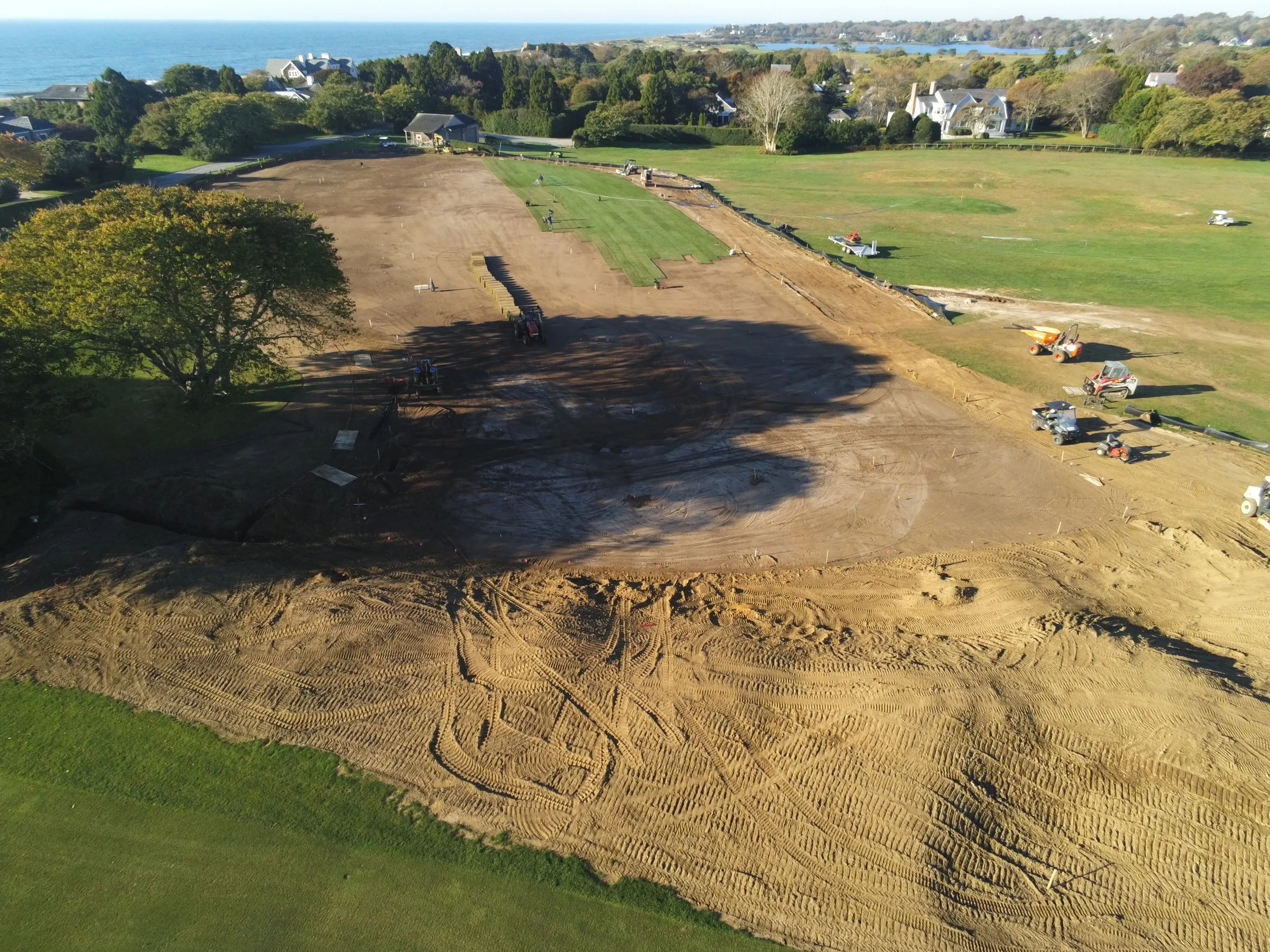  Sod Being Laid, Rough Shaping on Mounds. 