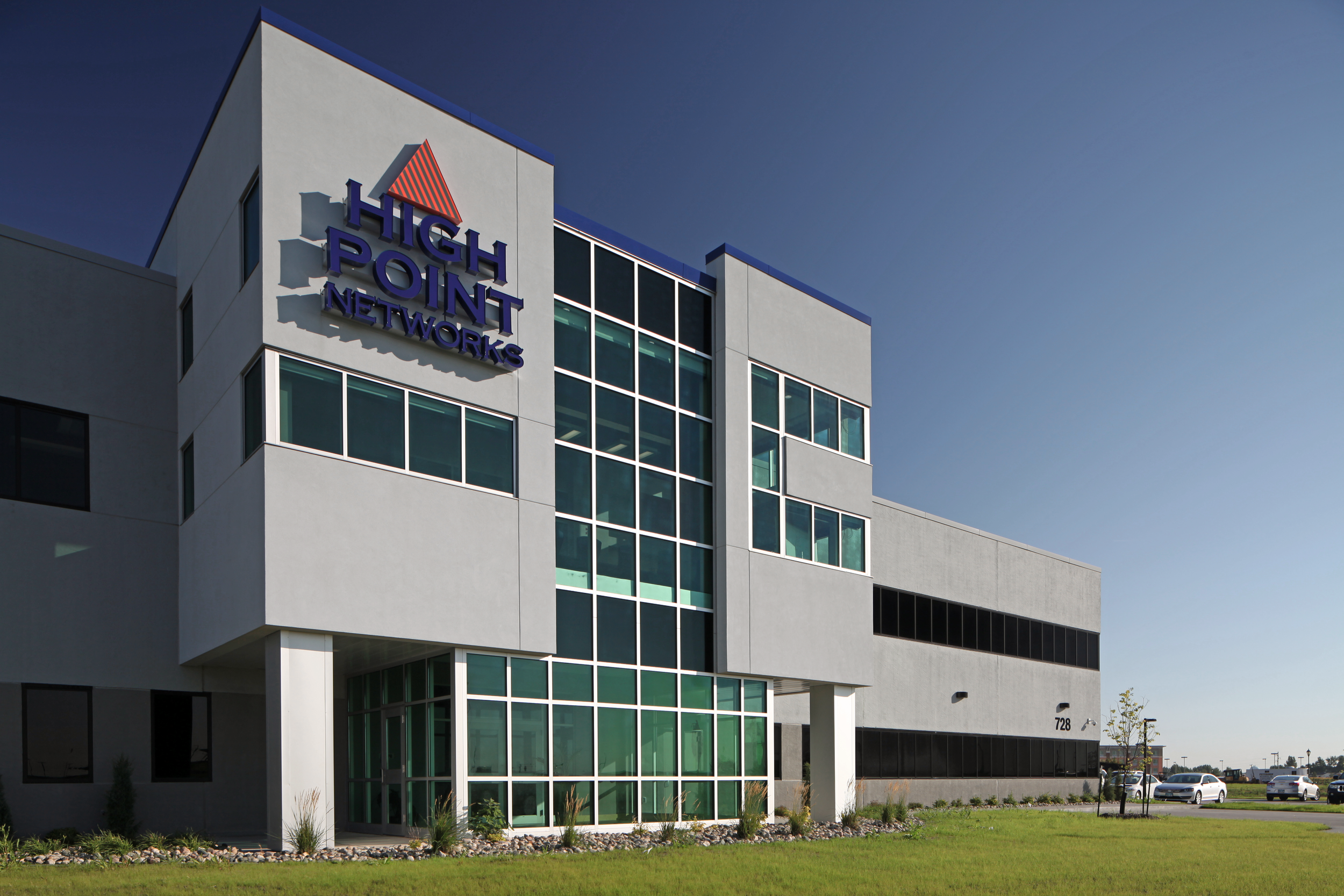 Exterior perspective featuring large storefront at High Point Networks office in Fargo ND