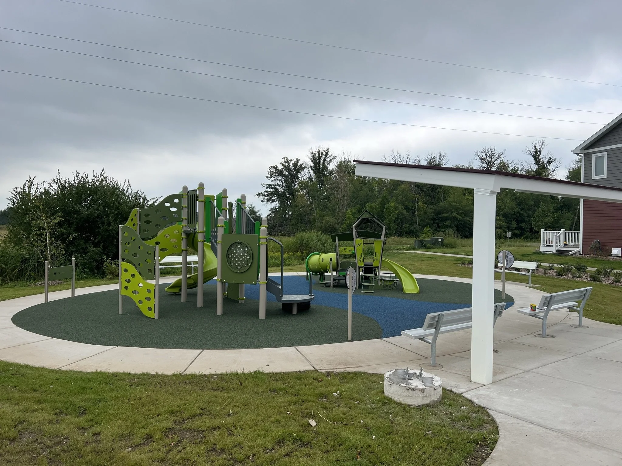 Playground and outdoor gathering space at Red Willow Estates modular community in Onamia, MN