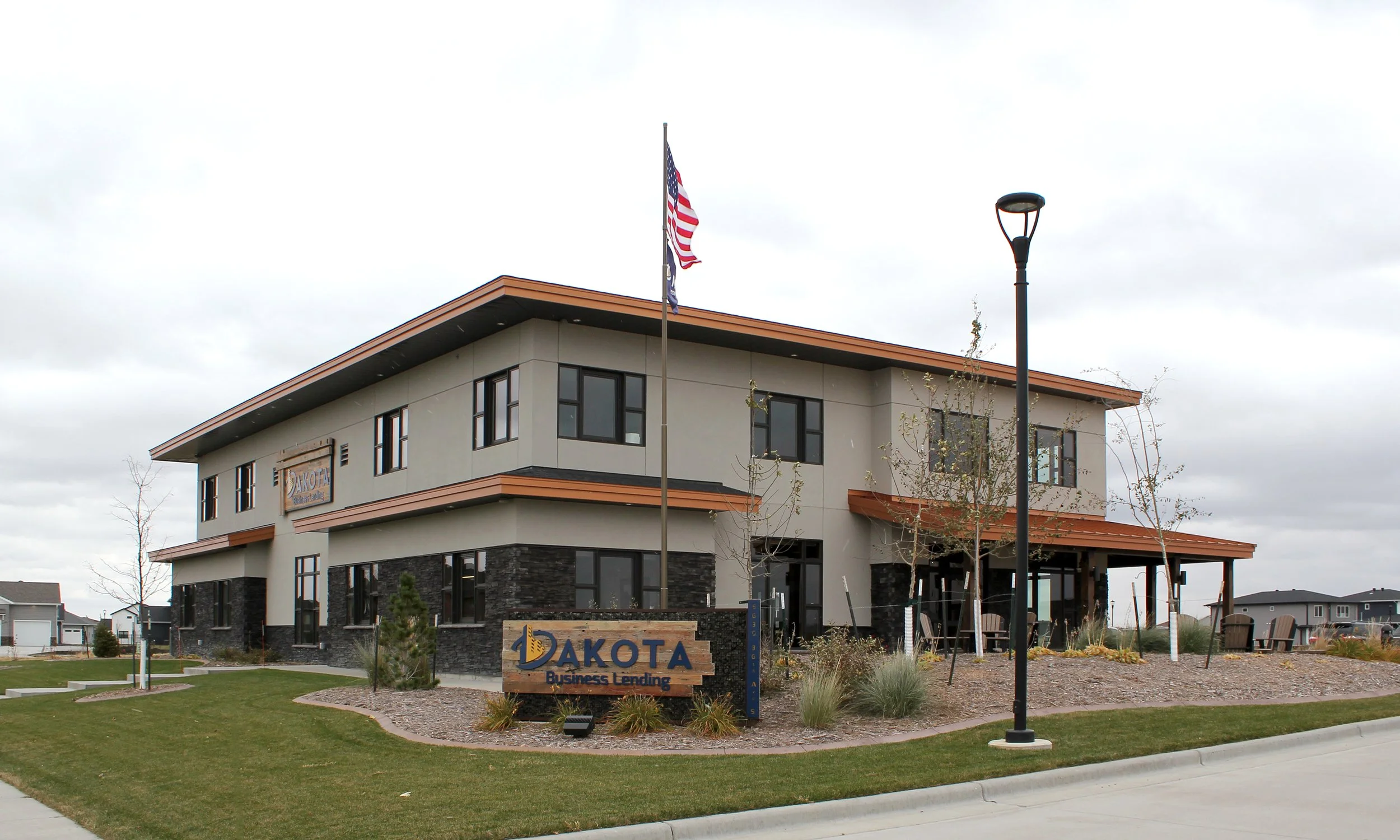 Exterior perspective of Dakota Lending building, landscaping, and signage in Fargo ND