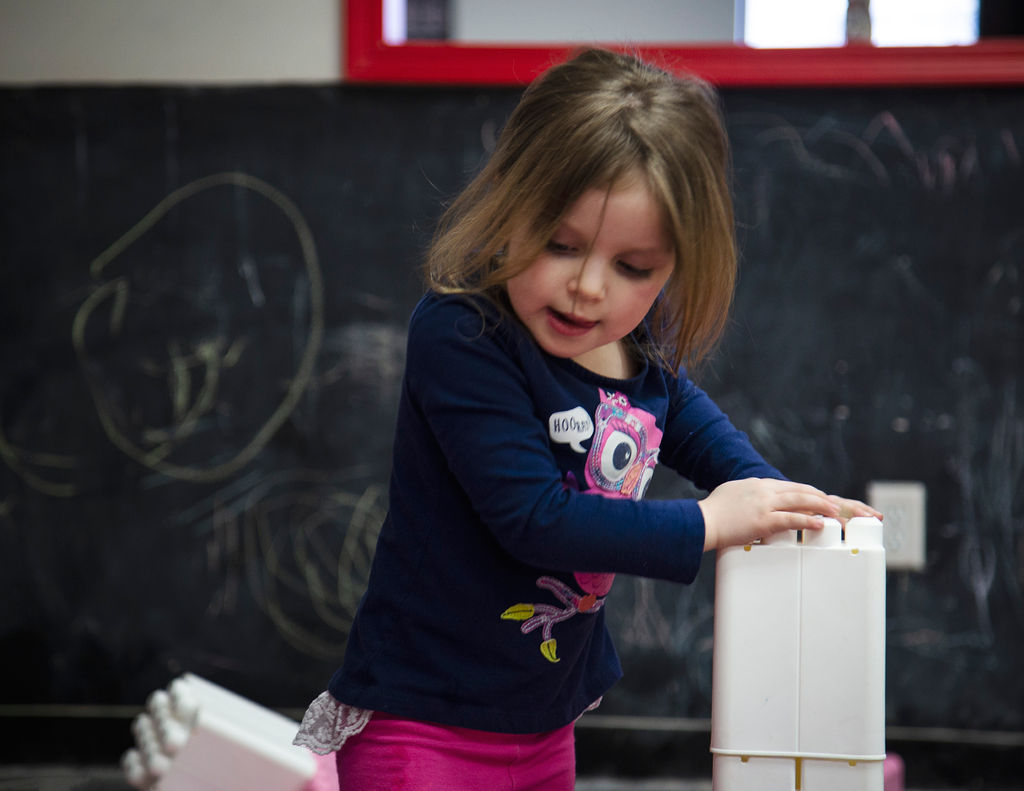 Girl building blocks