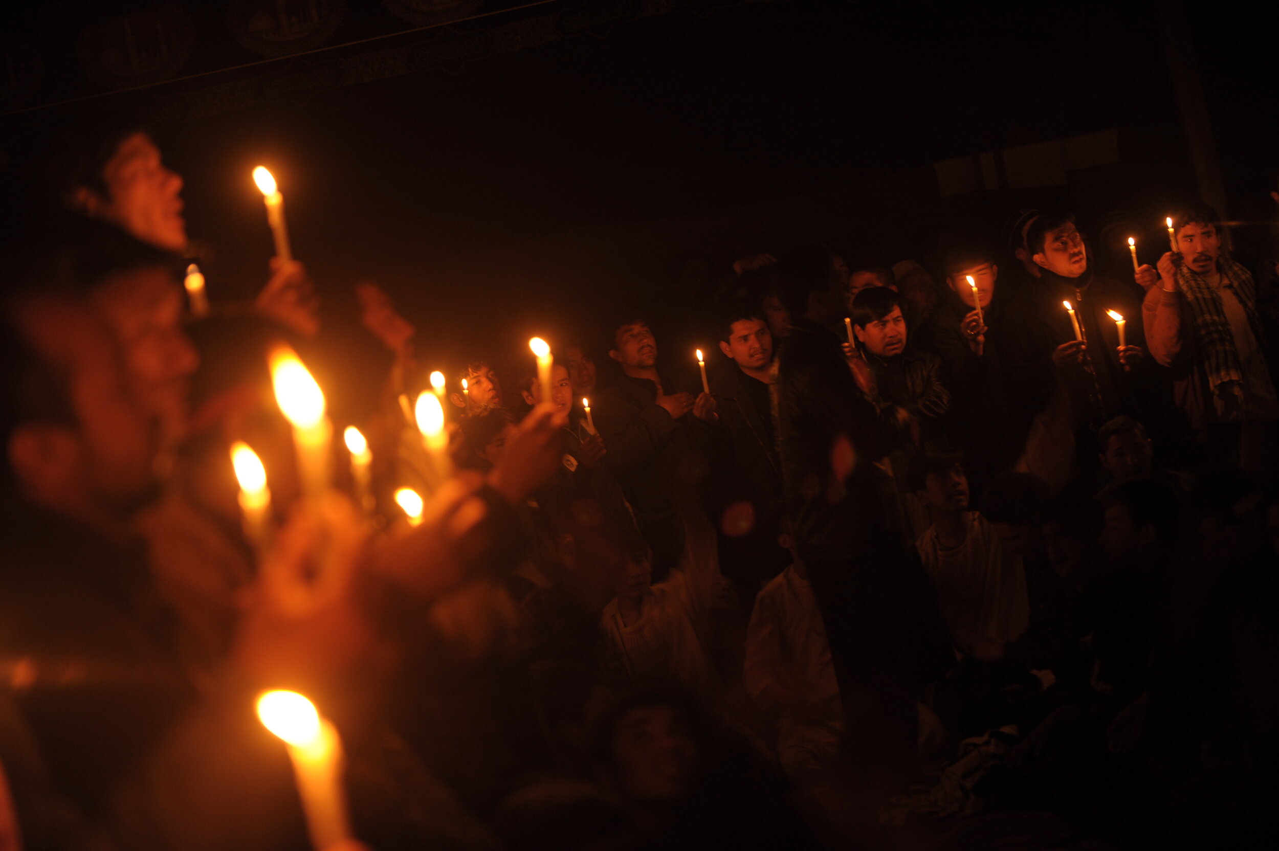  The mourners of Ashura hold candles on the occasion of the first night of the martyrdom of Imam Hussein and his companions .  AFP PHOTO/MASSOUD Hossaini 