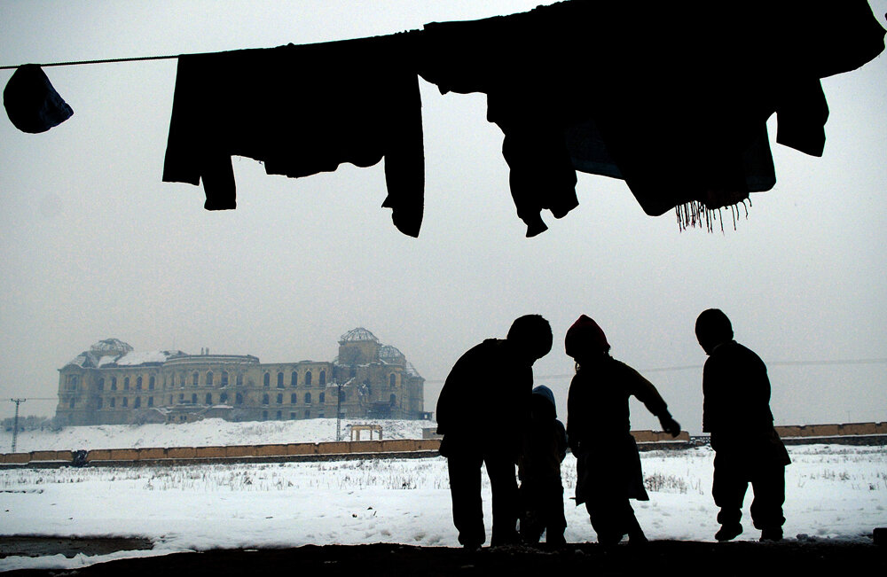  Afghan children play infront of their house in a destroyed erea in Kabul, 05 January 2008. The seasonal increase in the price of coal and wood works as a tool to warn war-weary Afghans that winter is arriving to make the already poverty stricken lif