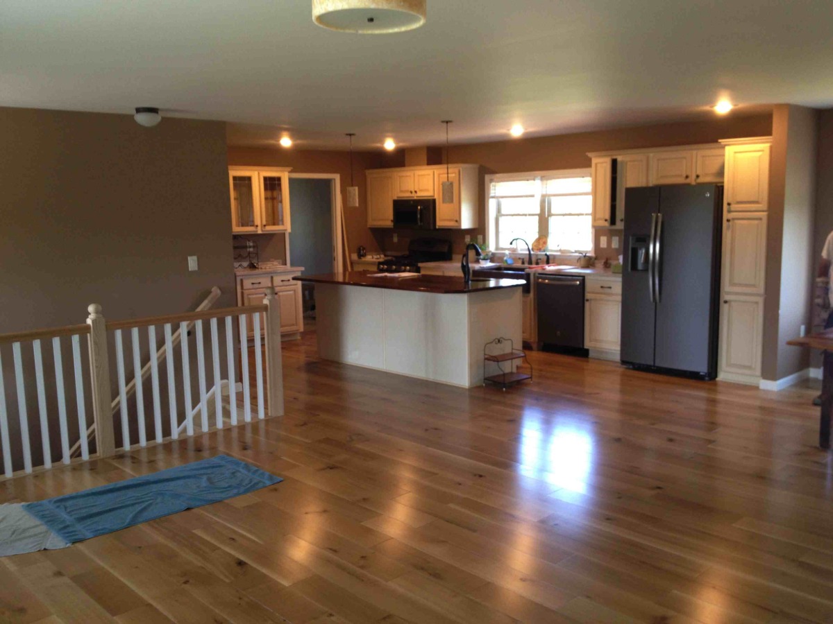 Hardwood Floor, Open Stairwell with Oak Railing and White balusters