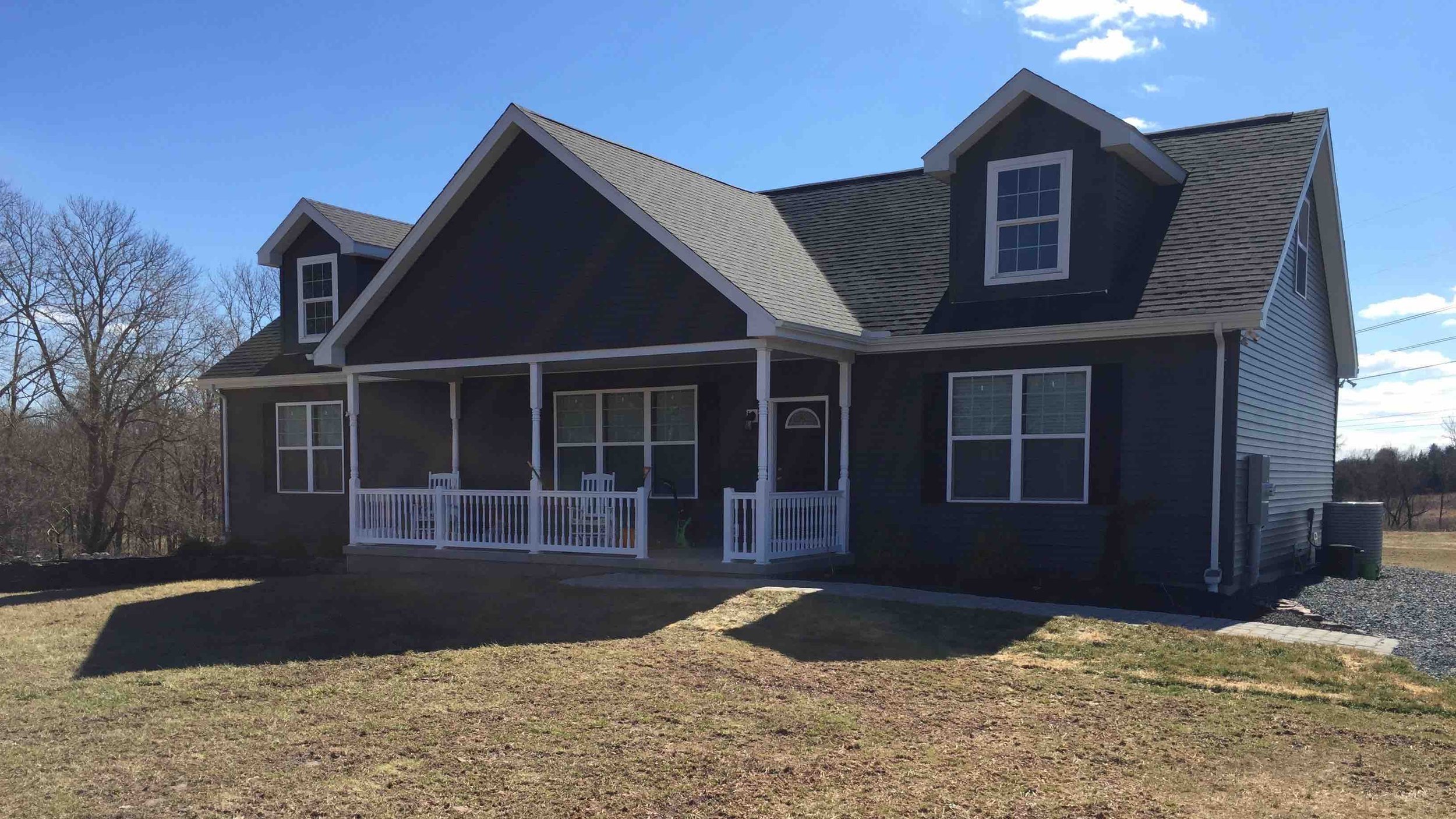 Covered Concrete Porch on 9/12 Cape Cod with Vinyl Railing