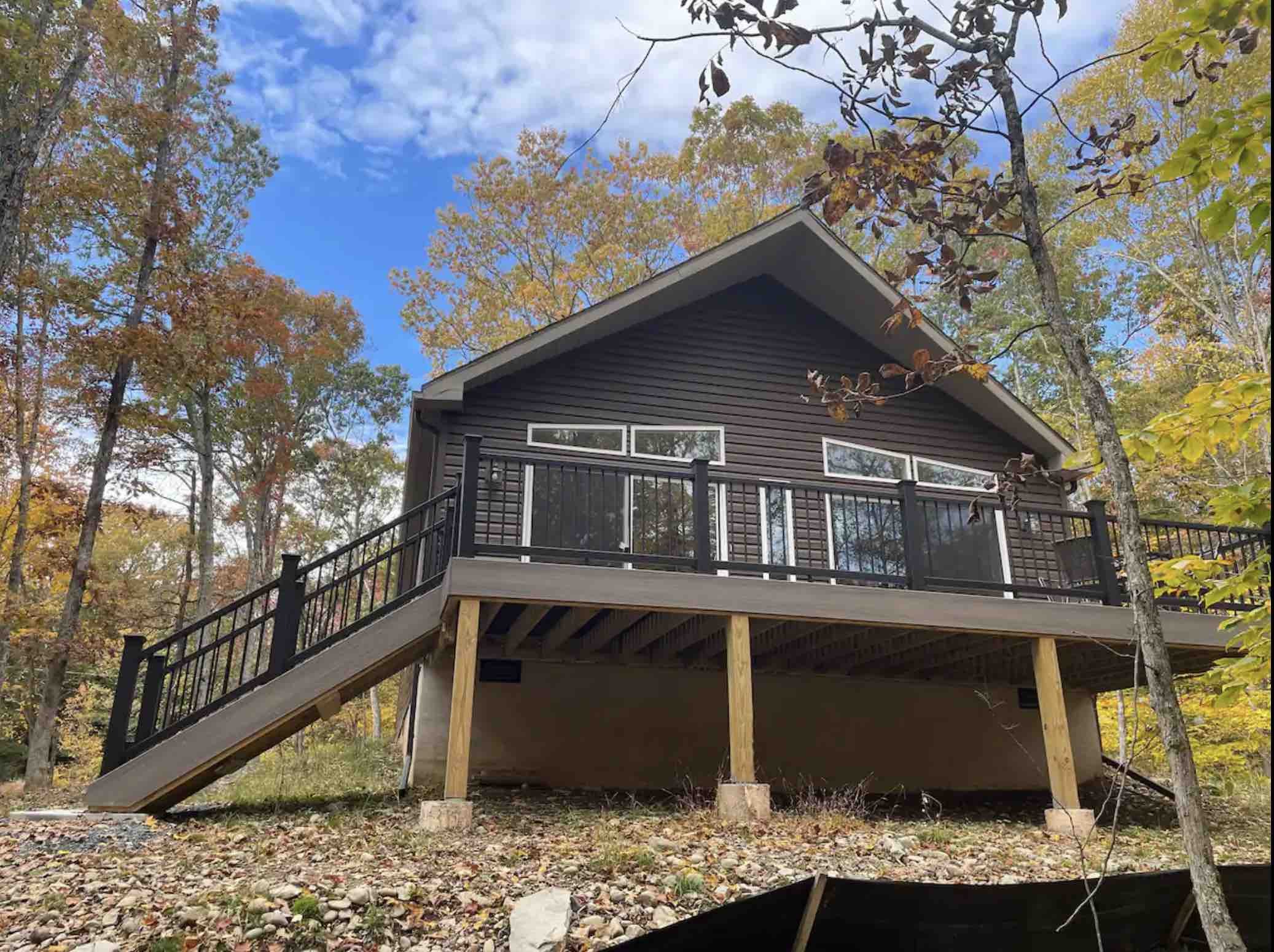 Composite Deck with Black Vinyl Railing on a 7/12 Ranch Chalet