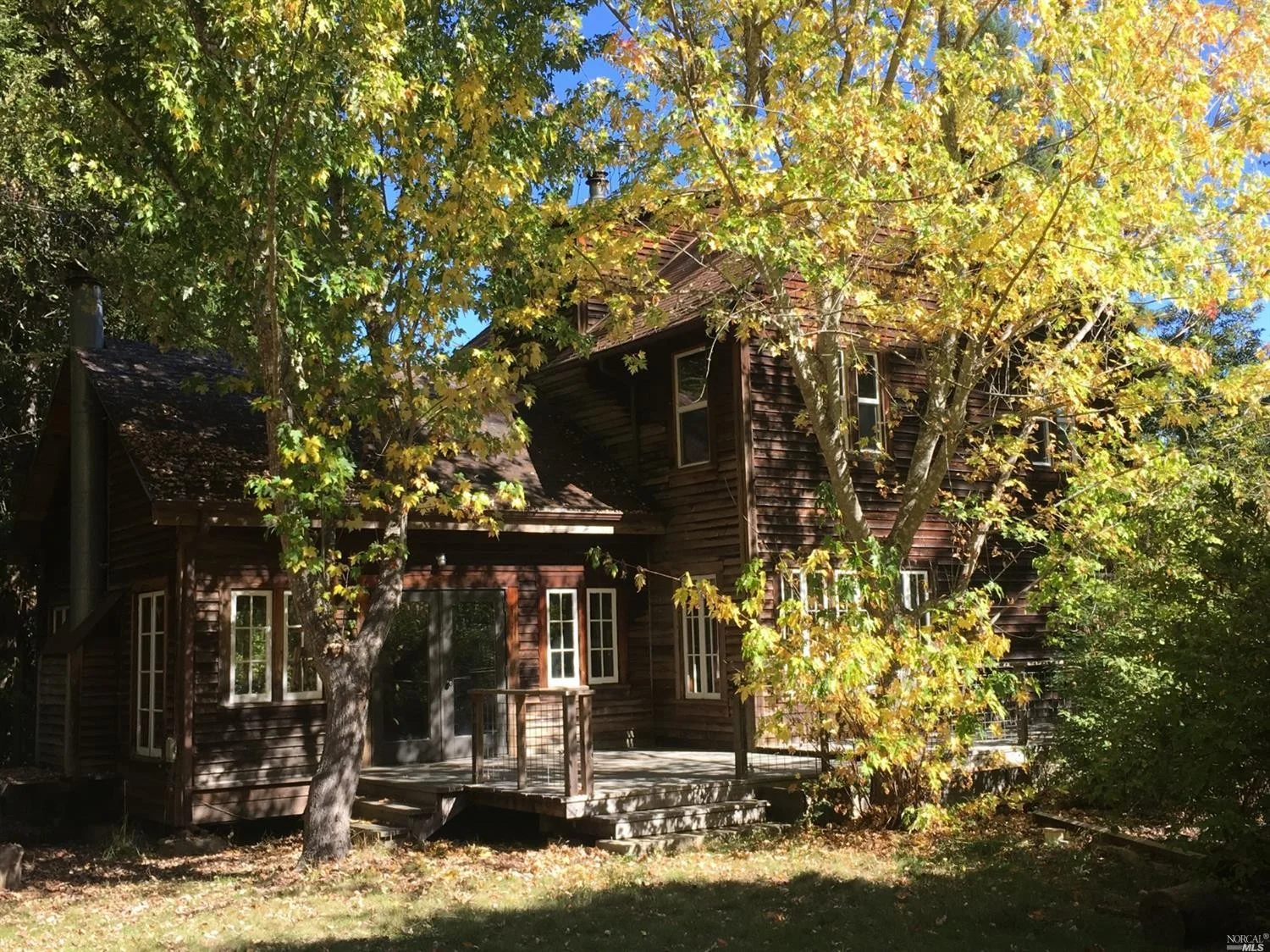 the sunny front yard of a family home for sale, Philo, CA