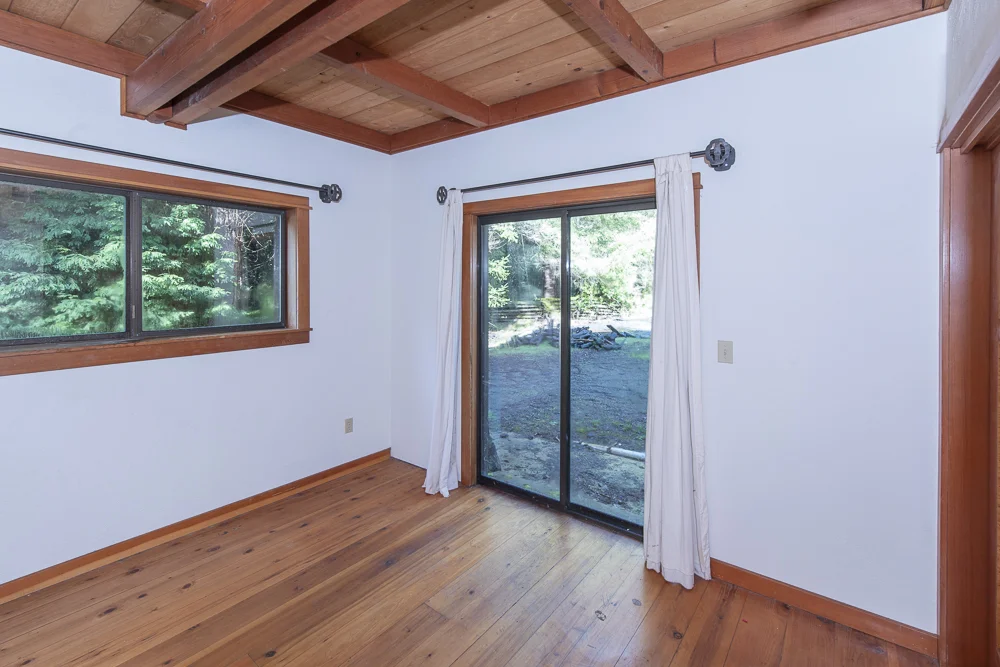 Bedroom with sliding door to deck.