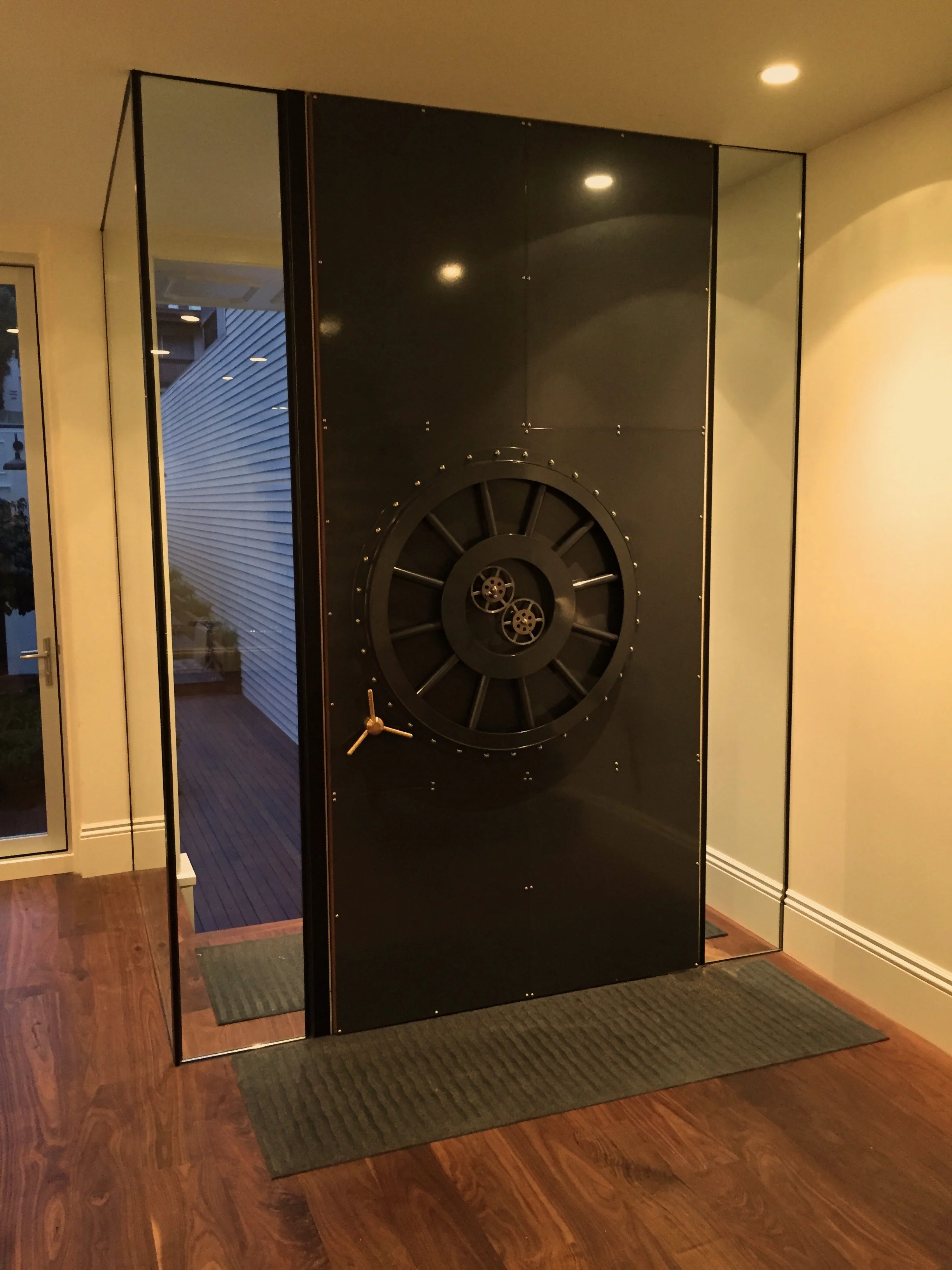 Bank Vault Front Door This entry door is a one-of-a-kind, elegant conversation piece, modeled after the doors of classic bank vaults. Functional mechanical parts add a touch of whimsy to this North Beach developer’s showcase home. The house was designed and built by Master Builders of San Francisco.